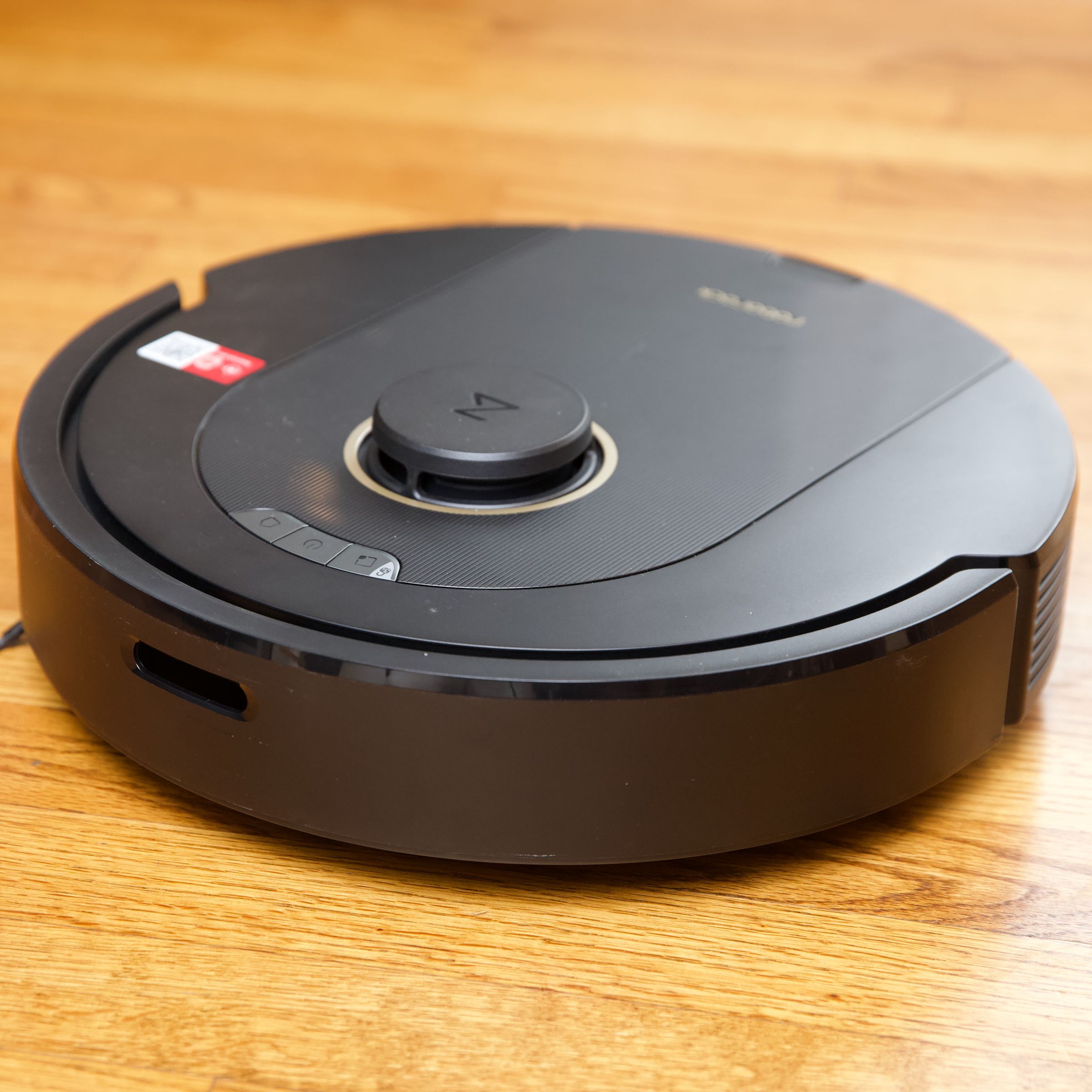 Roborock’s Q5 Pro on a hardwood floor.