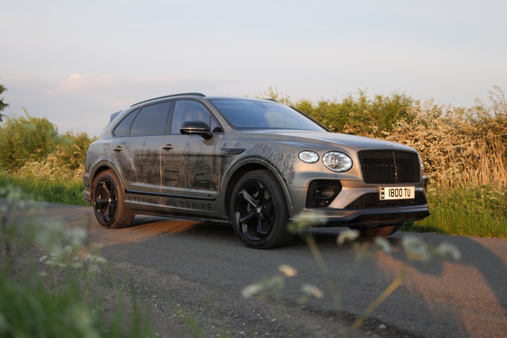 Green Bentley Bentayga on country road