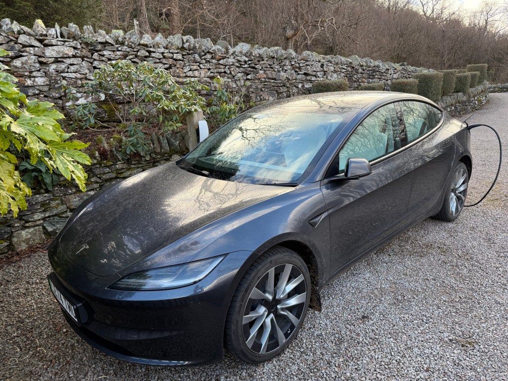 Tesla at-home charger and Model 3 car outside Tesla's Lake District house