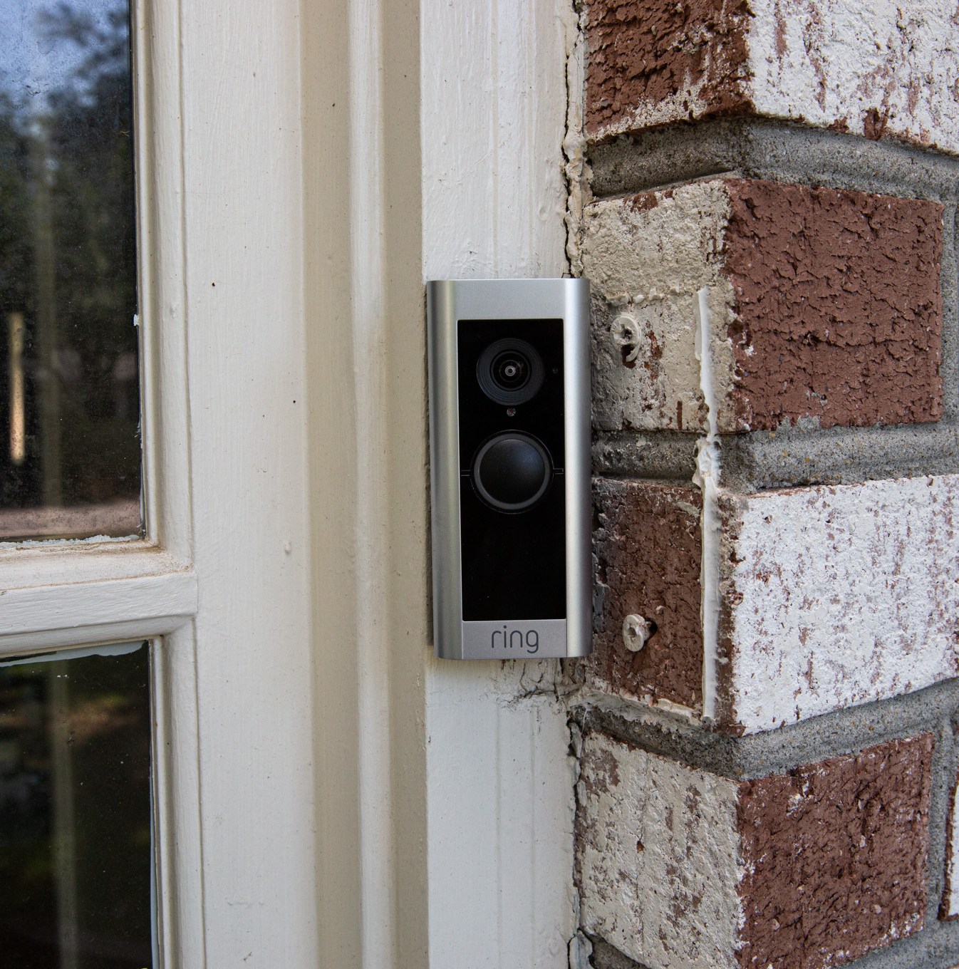 A Ring Video Doorbell Pro 2 mounted outside the front door of a house.