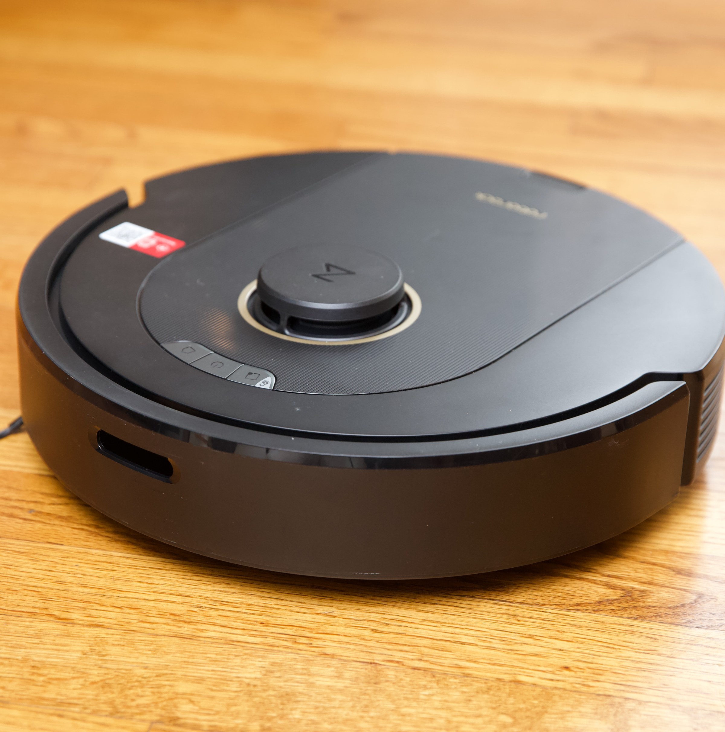 Roborock’s Q5 Pro on a hardwood floor.