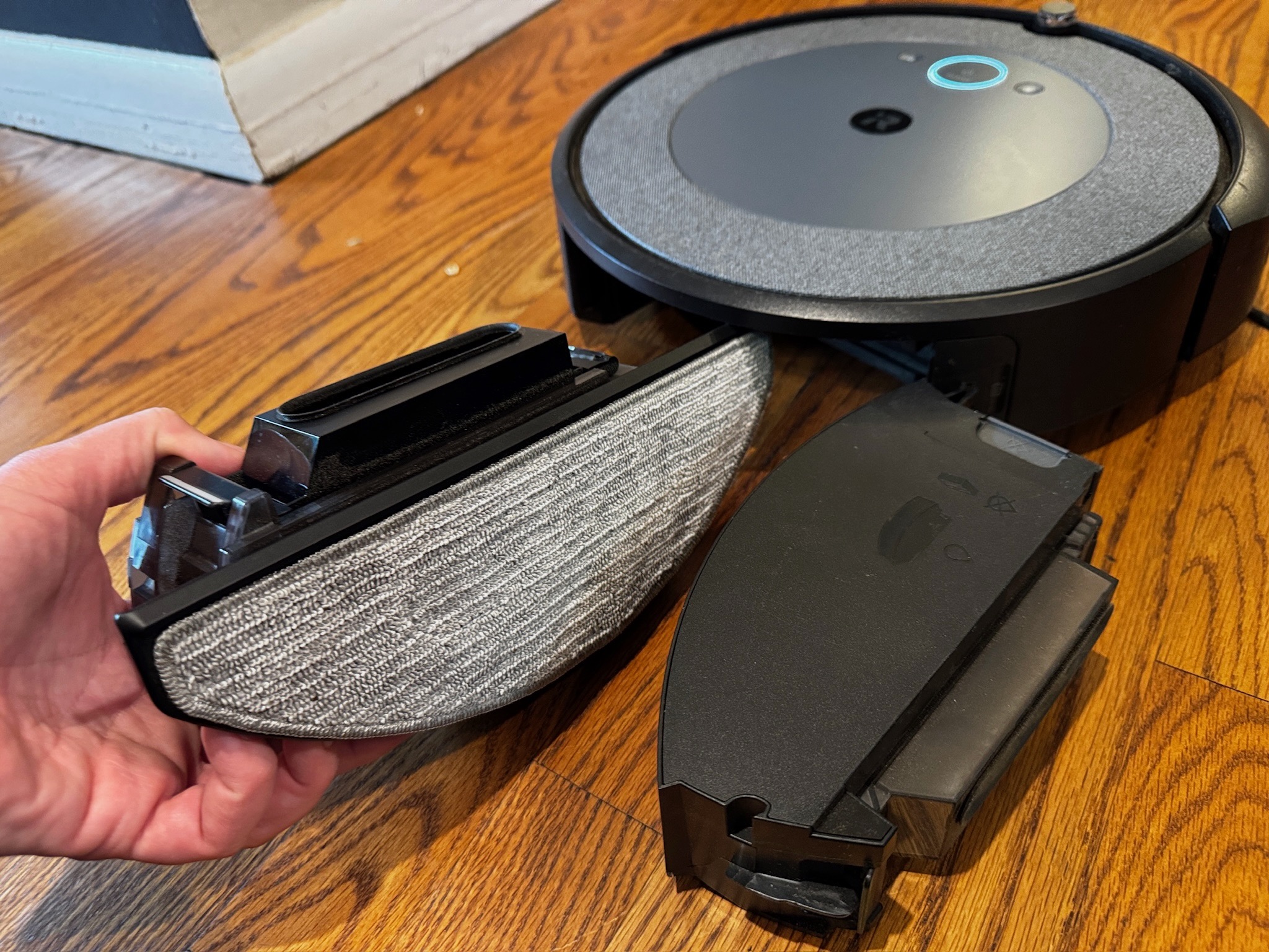 The i5 Combo comes with swappable bins, one for mopping and vacuuming and one for just vacuuming. The robot knows which bin you have attached and cleans it accordingly.
