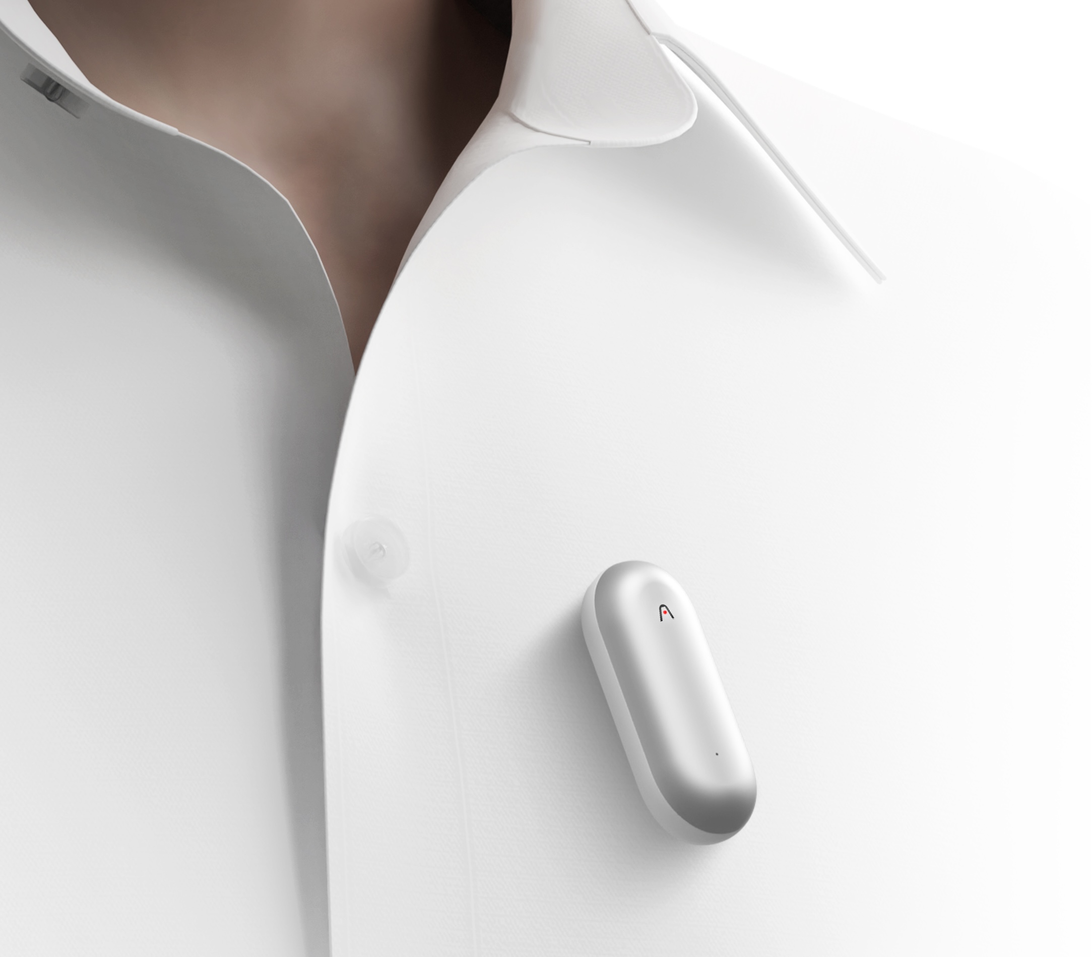 A photo of the Plaud NotePin attached to a lapel.