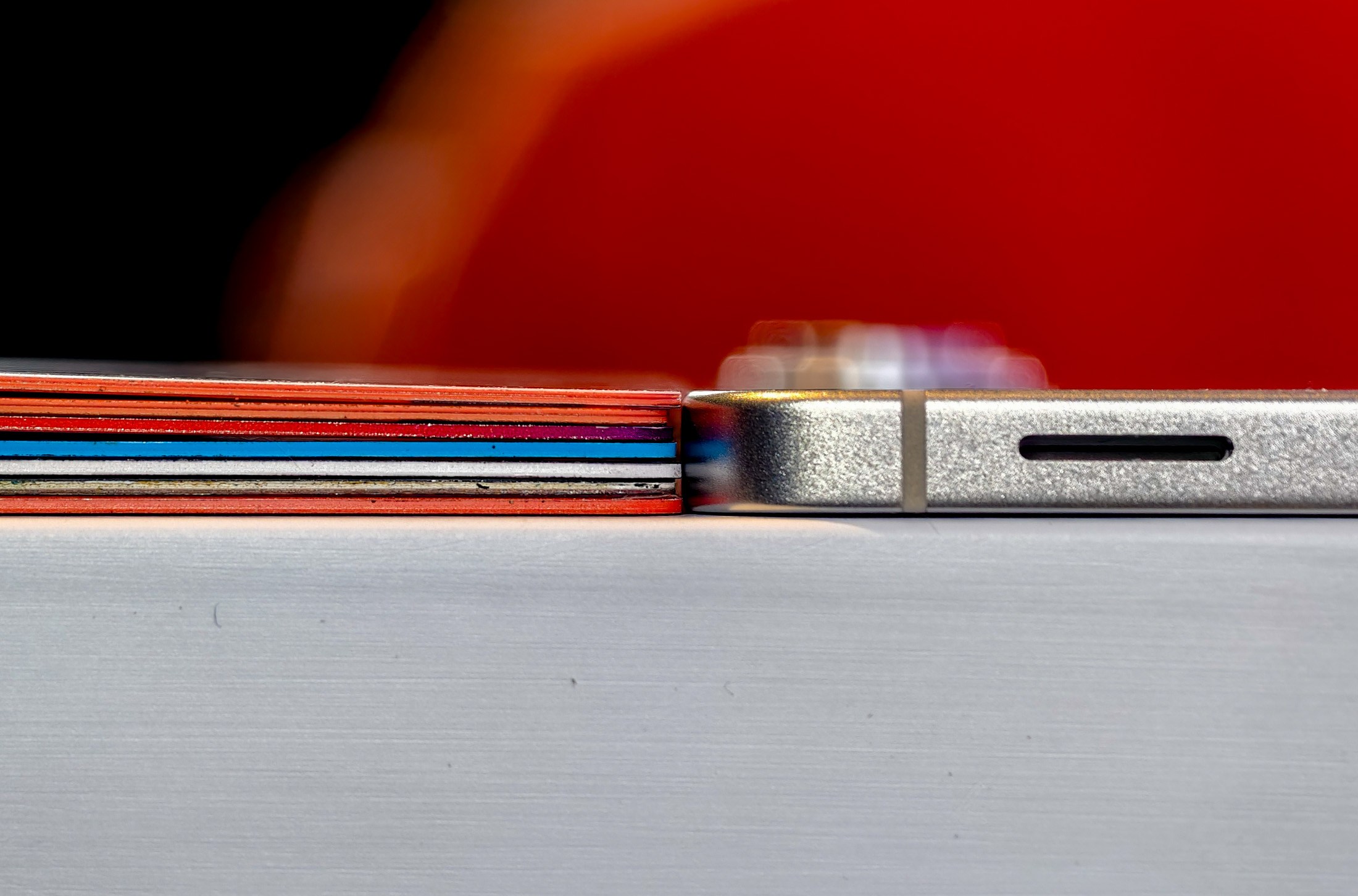 Samsung Galaxy S25 Edge next to a stack of credit cards