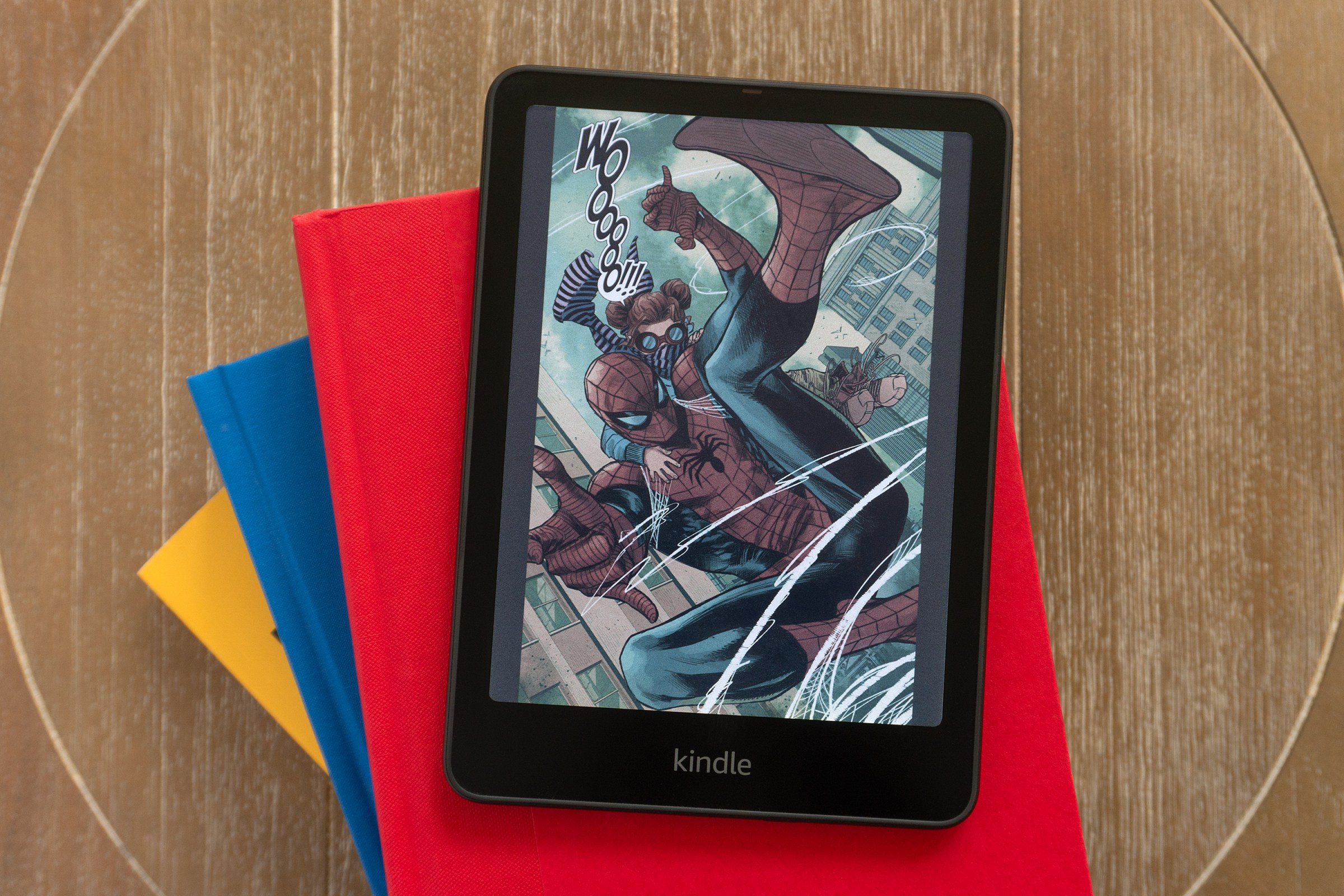 The Amazon Kindle Colorsoft on a stack of books.