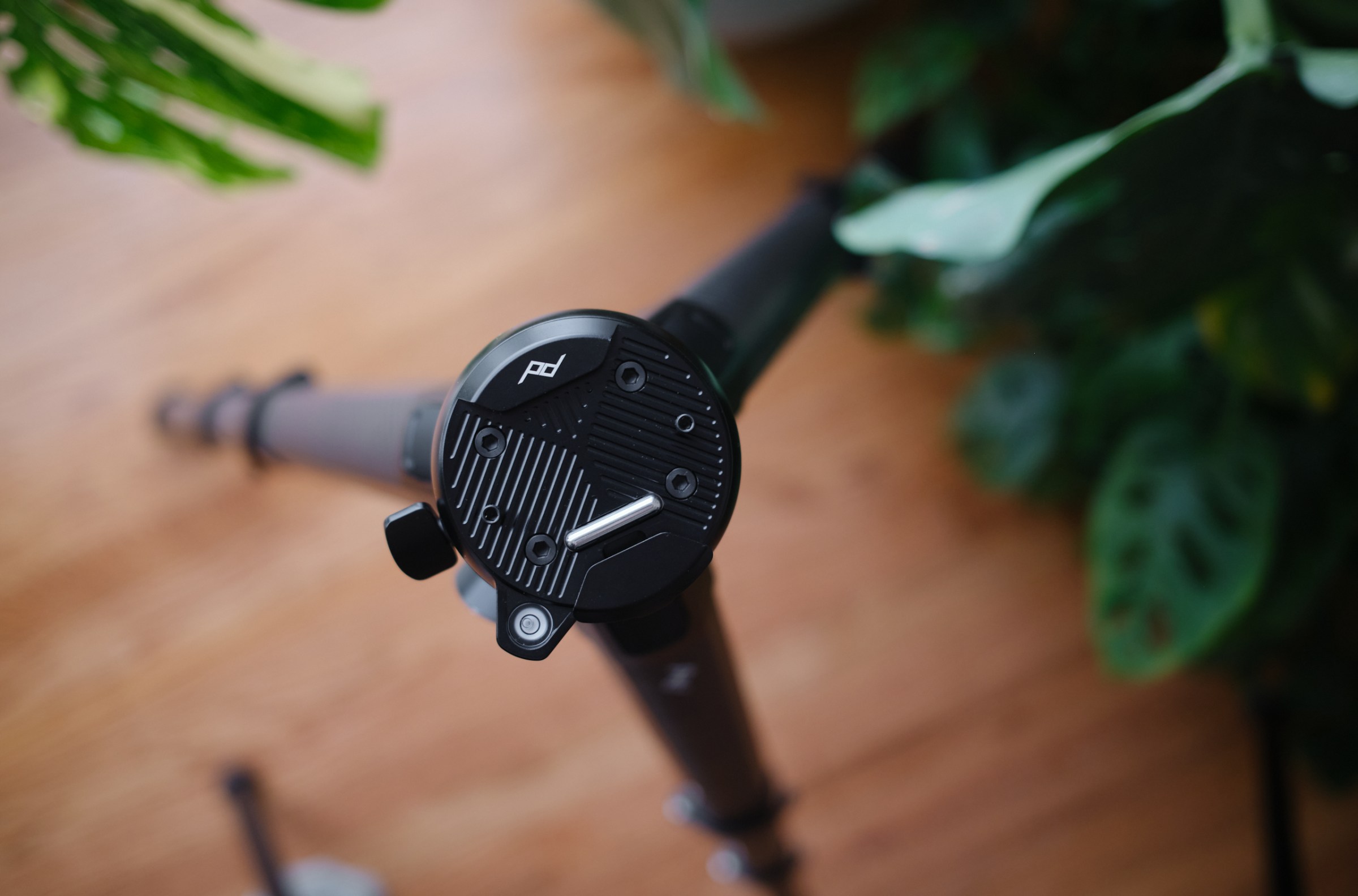 New ball head feels more robust, keeps your camera safely locked in, pans, but can’t tilt.