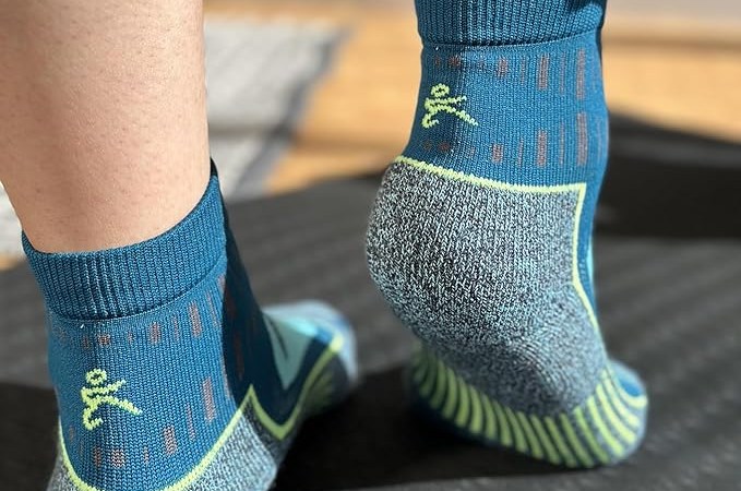bottom of legs showing off blue socks