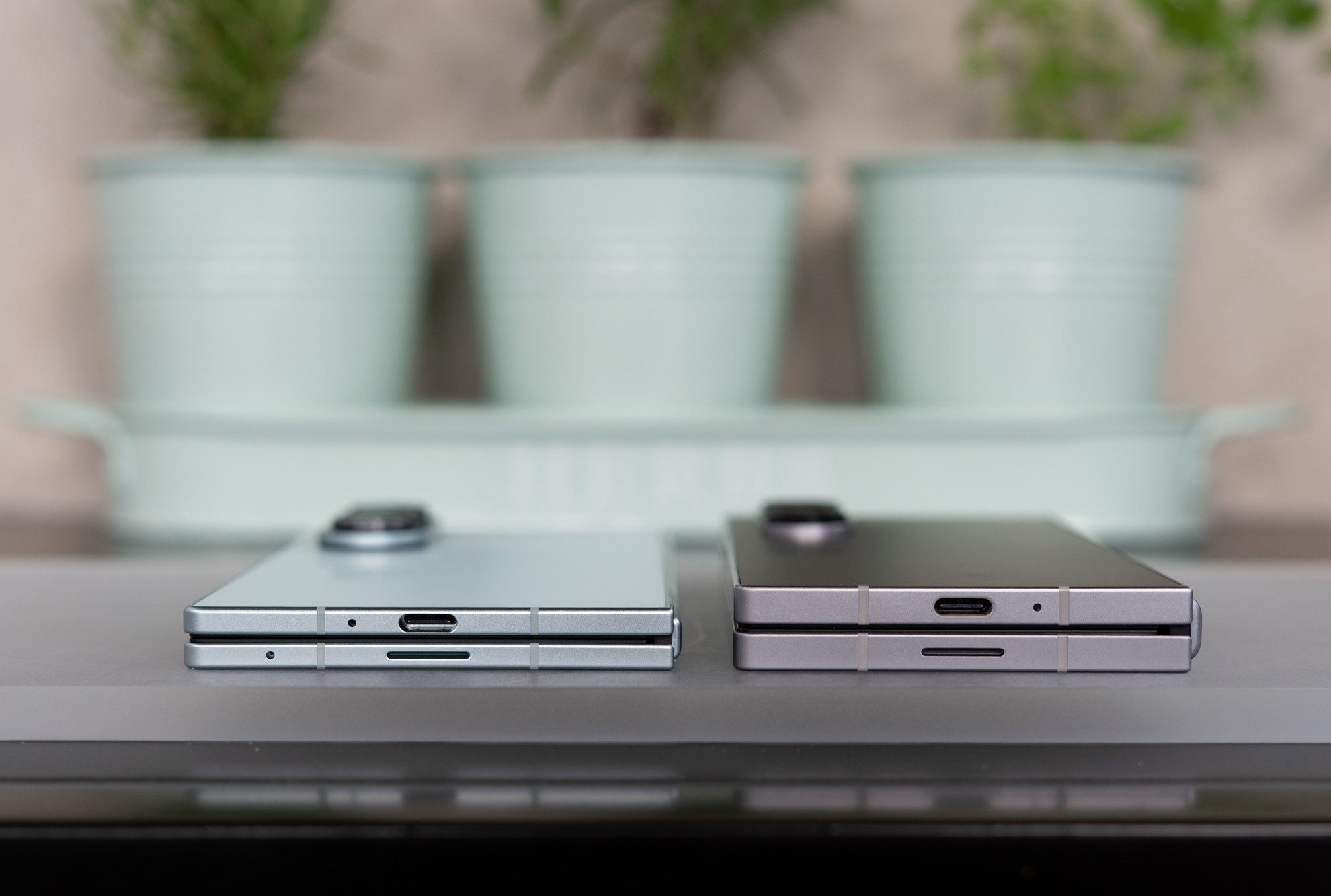 Samsung Galaxy Z Fold 7 shown next to Z Fold 6 folded in half.