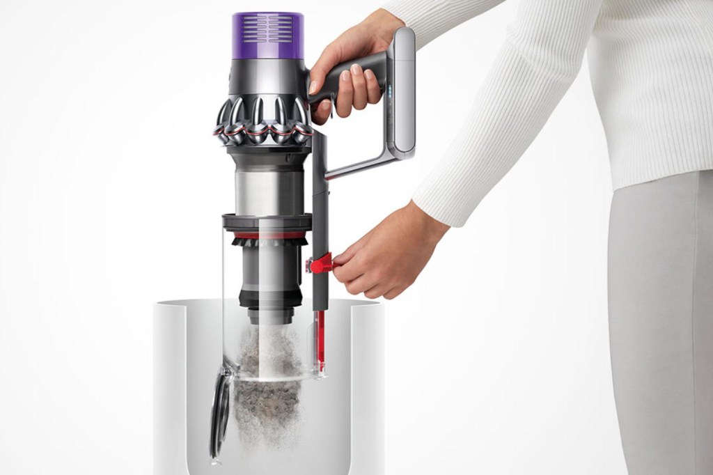 Dyson cordless vacuum cleaner being emptied