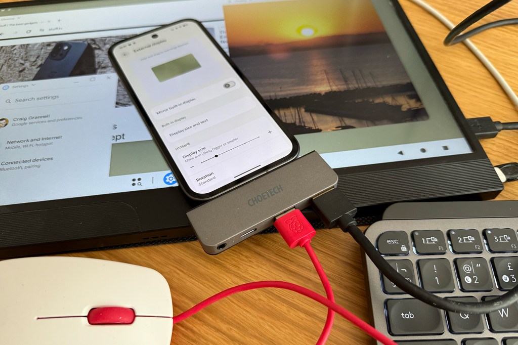 Messy tech on a desk, for Android 16 desktop mode