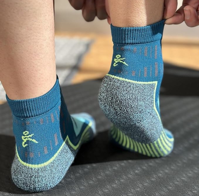 bottom of legs showing off blue socks