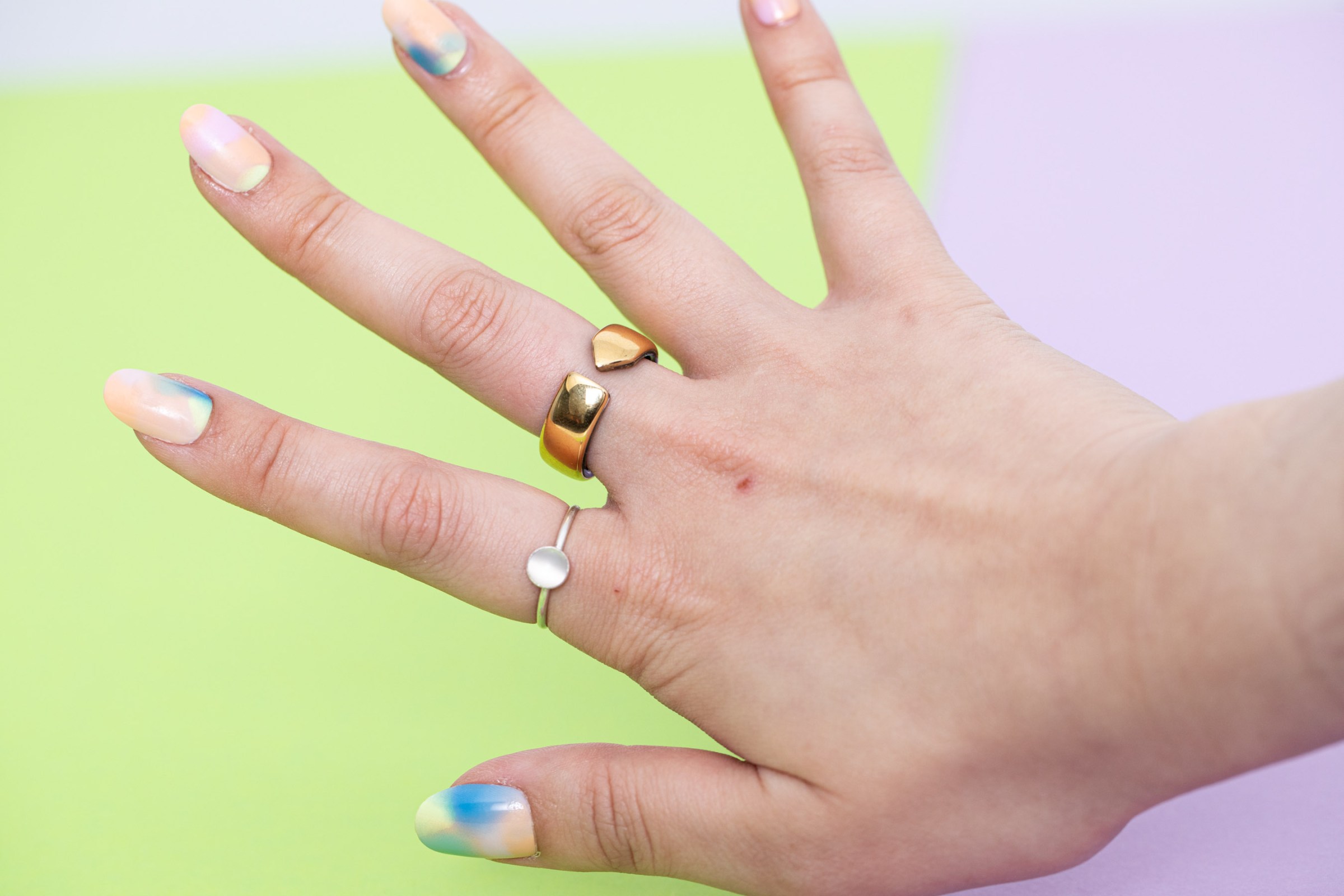 Picture of the Evie Ring on a well manicured hand.