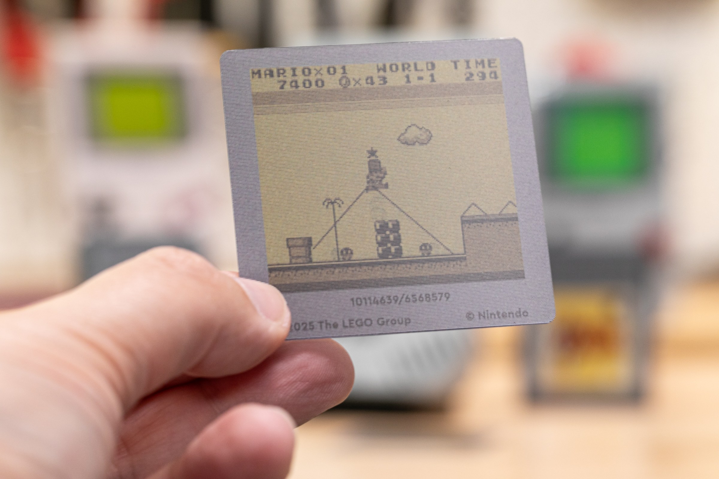 The image of Mario jumping on a faux game boy screen has ridges all over it, because that’s the lenticular lens that allows light to show different images at different angles.