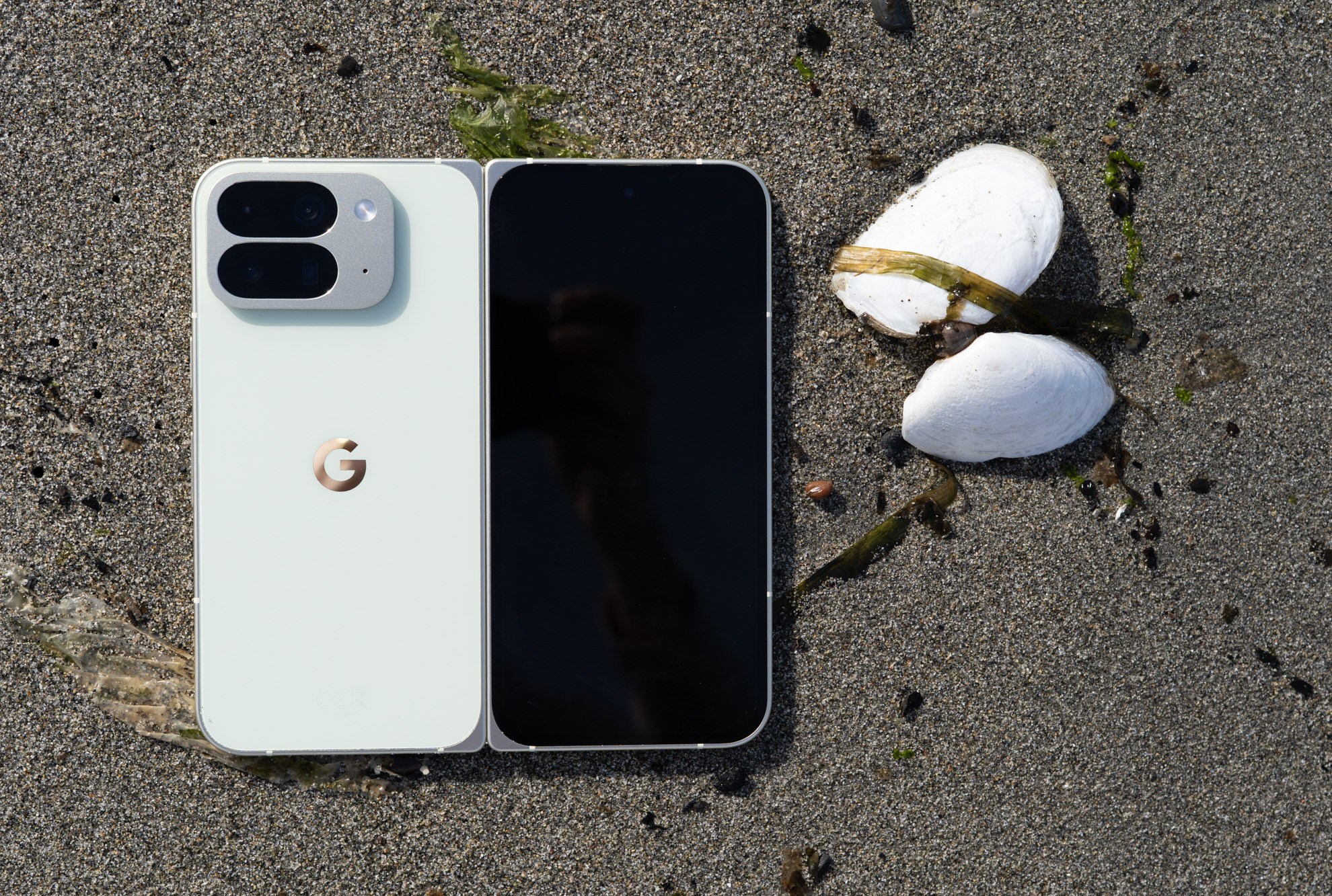 Google Pixel 10 Pro Fold on a sandy beach.