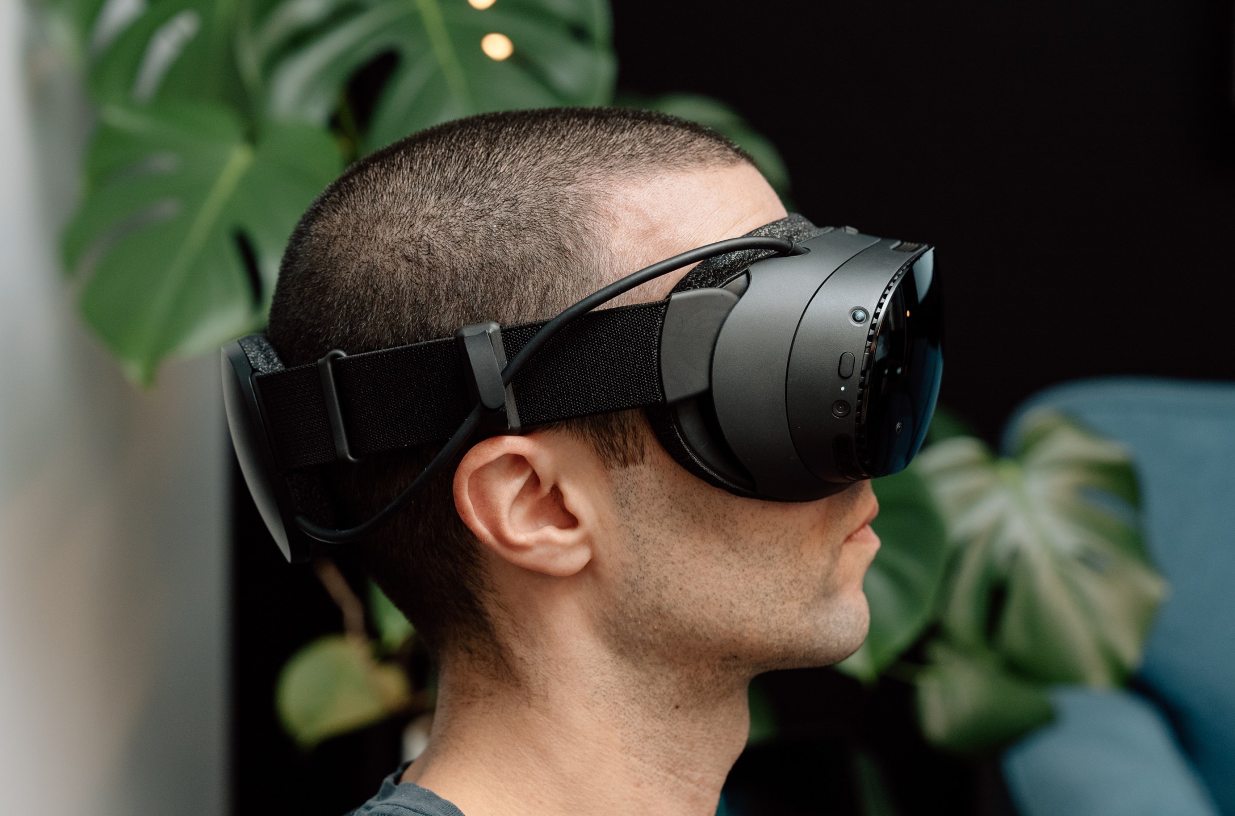 The Verge’s Jay Peters wearing Valve’s Steam Frame VR headset, from the side.