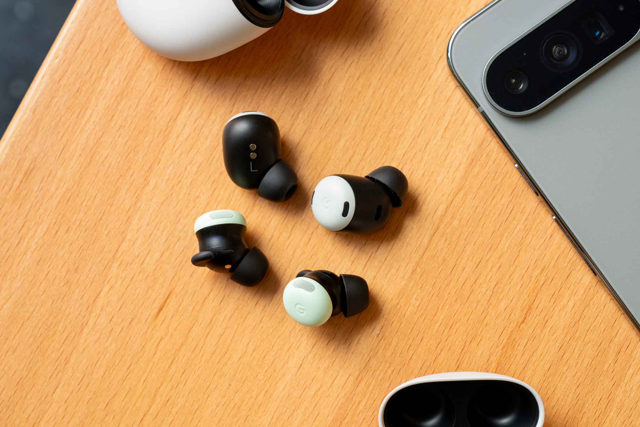 A hands-on photo of Google’s Pixel Buds Pro 2 earbuds.