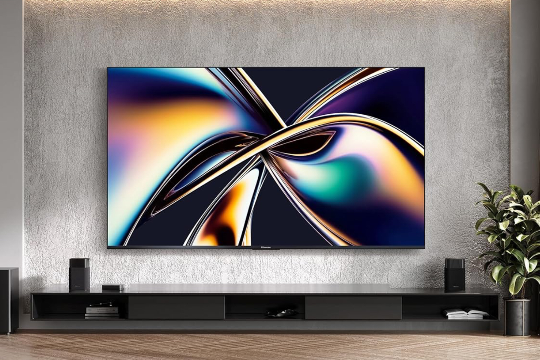 Hisense's U8QG TV mounted on a wall above an entertainment center.