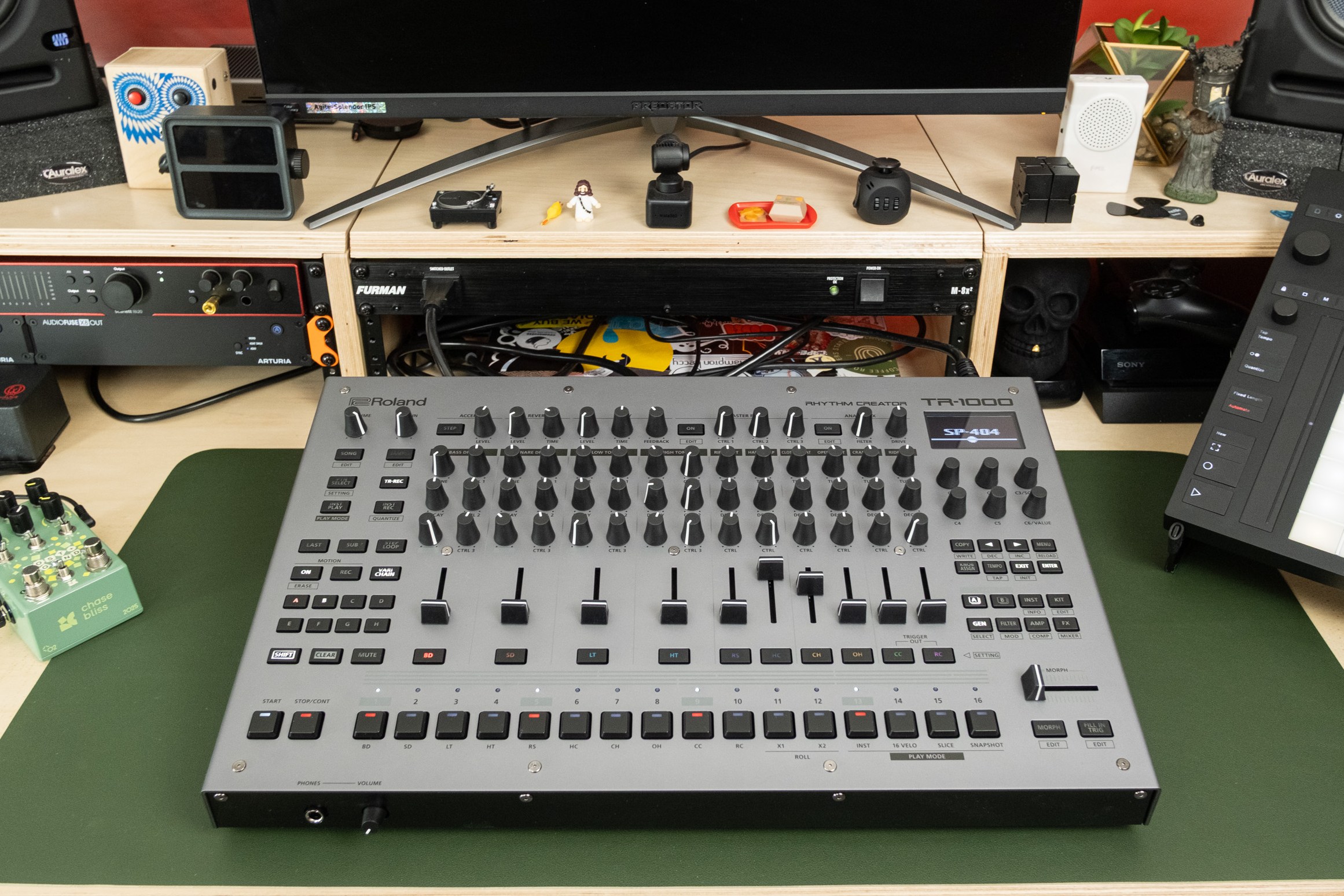 A wider shot of the TR-1000 on a desk alongside a Push 3 and a Chase Bliss Lost + Found.