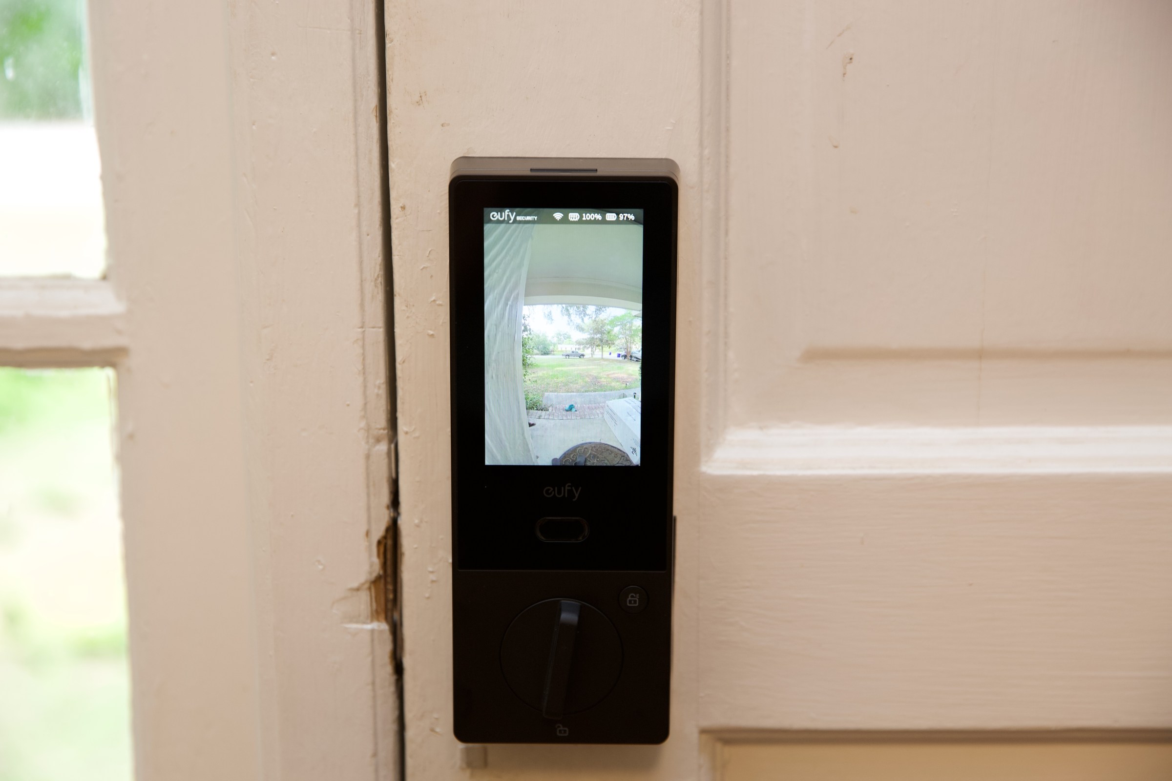 The rear of the lock is a screen that turns on when someone rings the doorbell. It can be manually activated by a button on the back.
