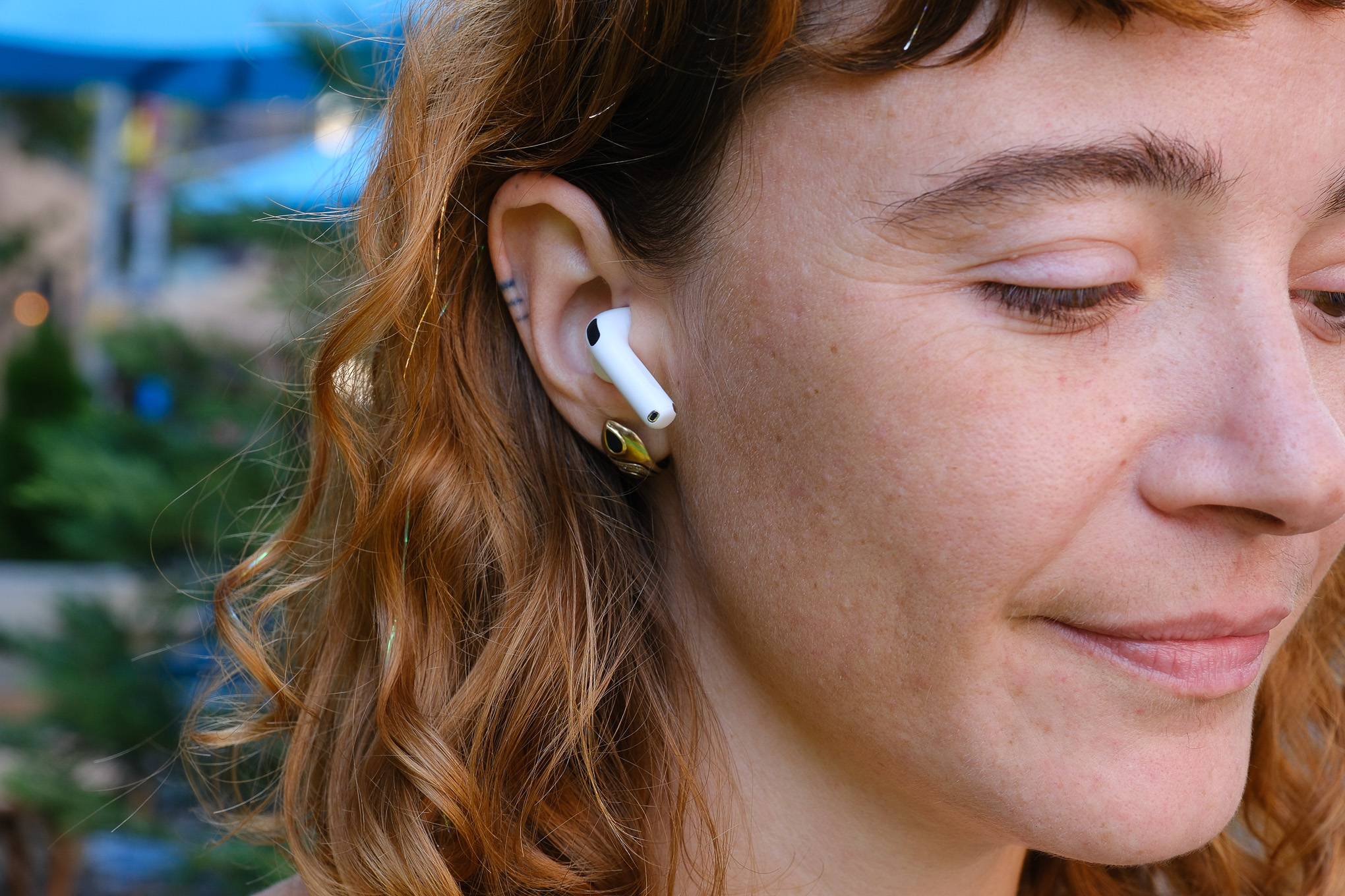 A hands-on photo of Apple’s AirPods 4 wireless earbuds.