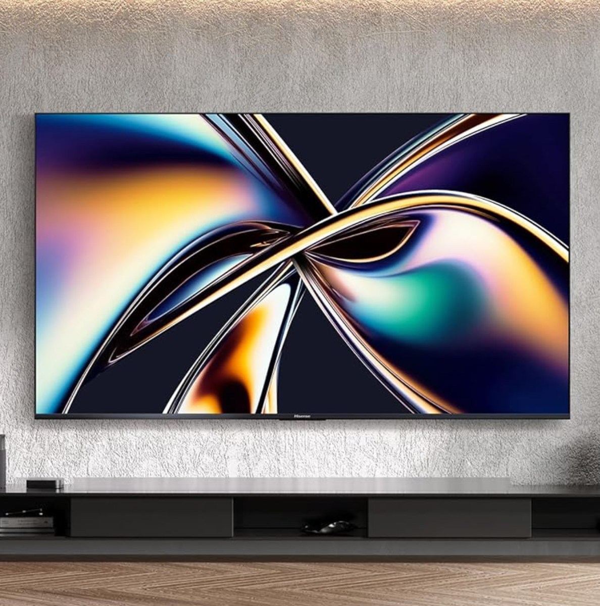 Hisense's U8QG TV mounted on a wall above an entertainment center.