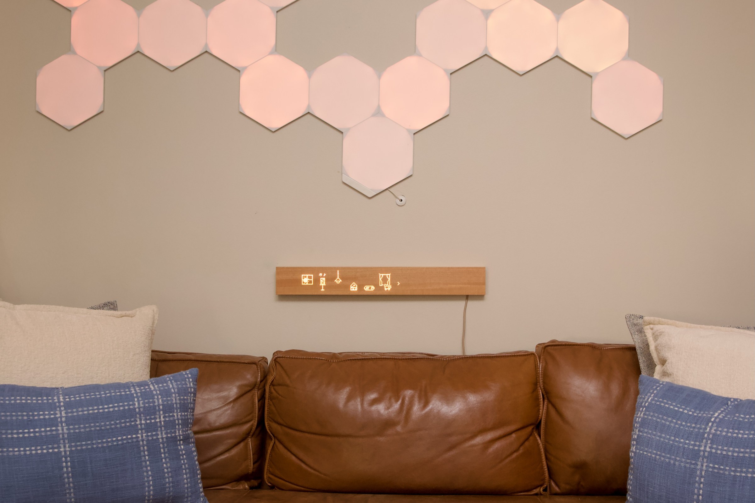 The Mui Board is a screenless touch interface for my smart lights, Sonos speakers, and other devices. I installed it below these Nanoleaf panels, which also double as smart home buttons.