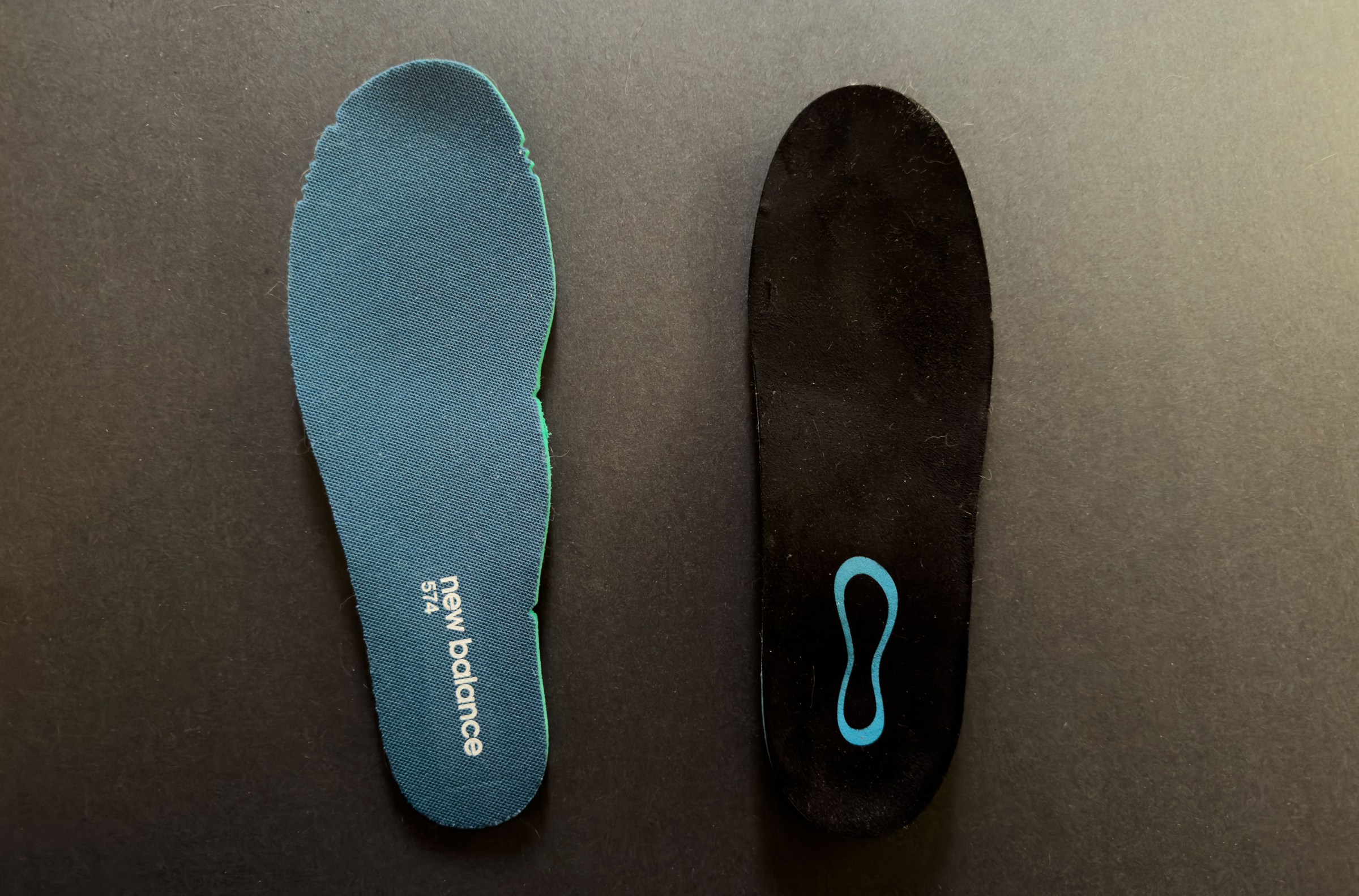 Top-down view of one new balance 574 insert and one Groove insert.
