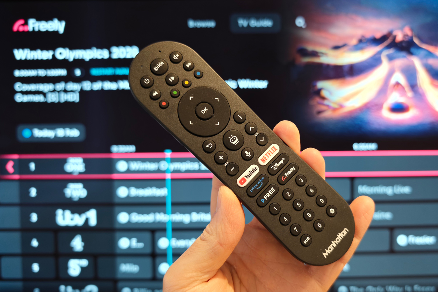 Manhattan Aero 4K TV Streamer with Freely review remote in hand