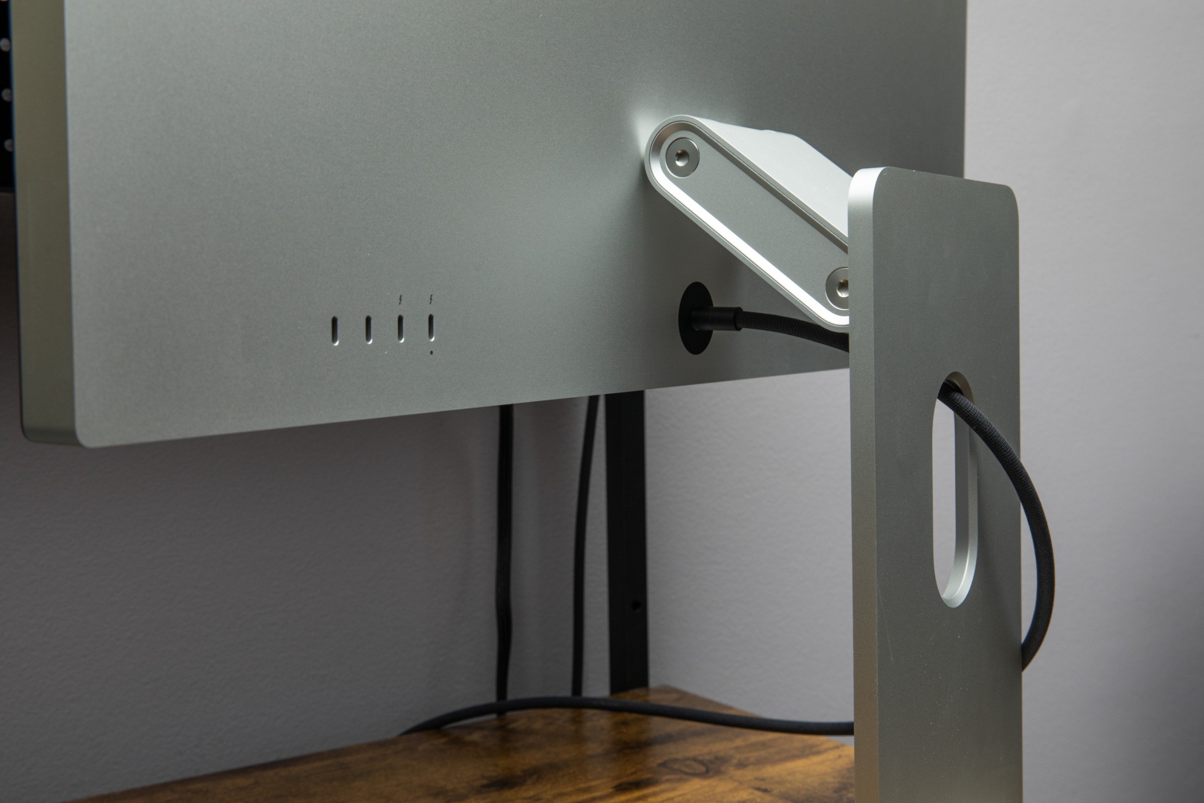 A closeup of the Apple Studio Display XDR adjustable stand in its highest position.