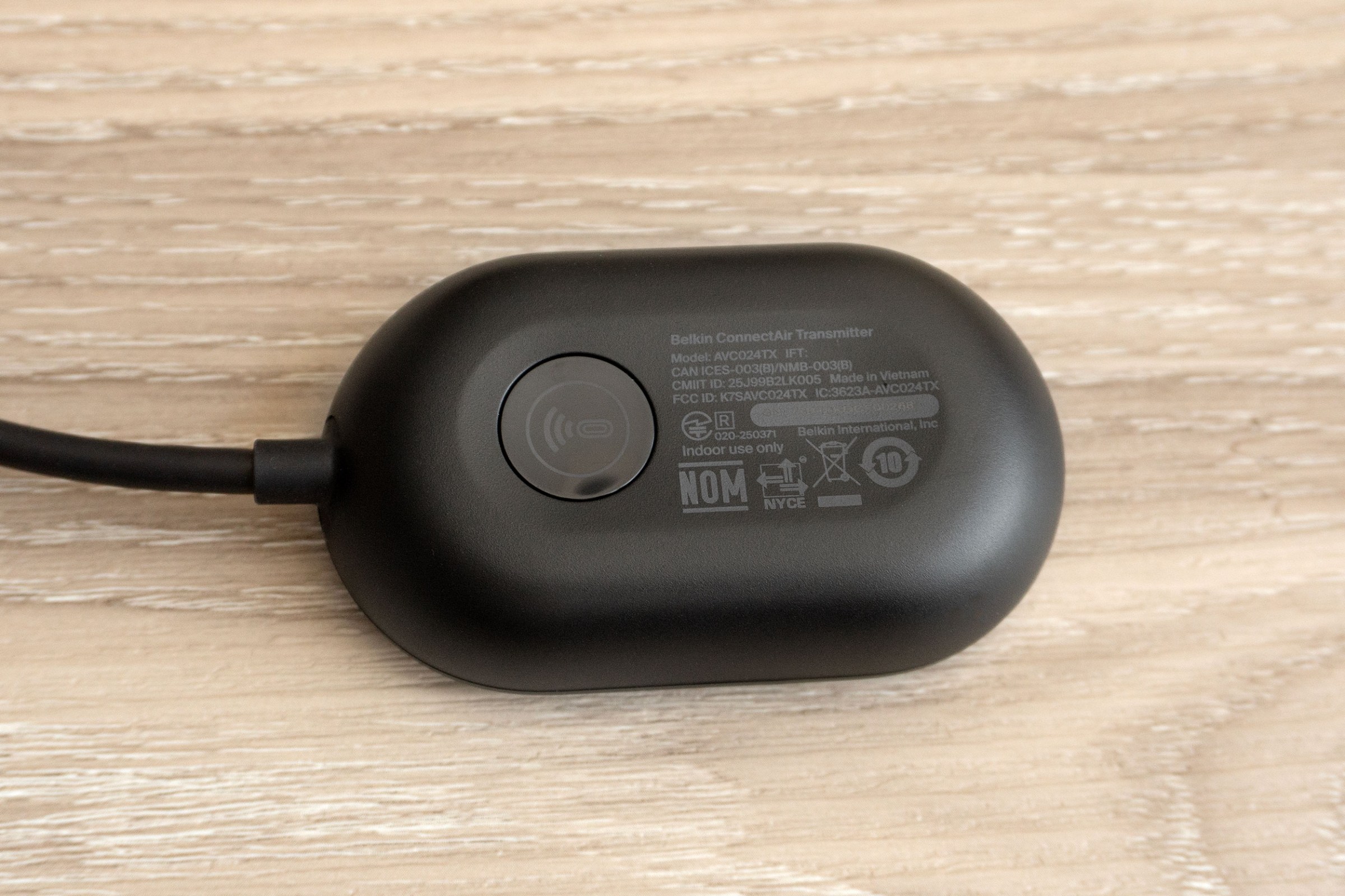 A close-up of the reset button on the underside of the Belkin ConnectAir transmitter.