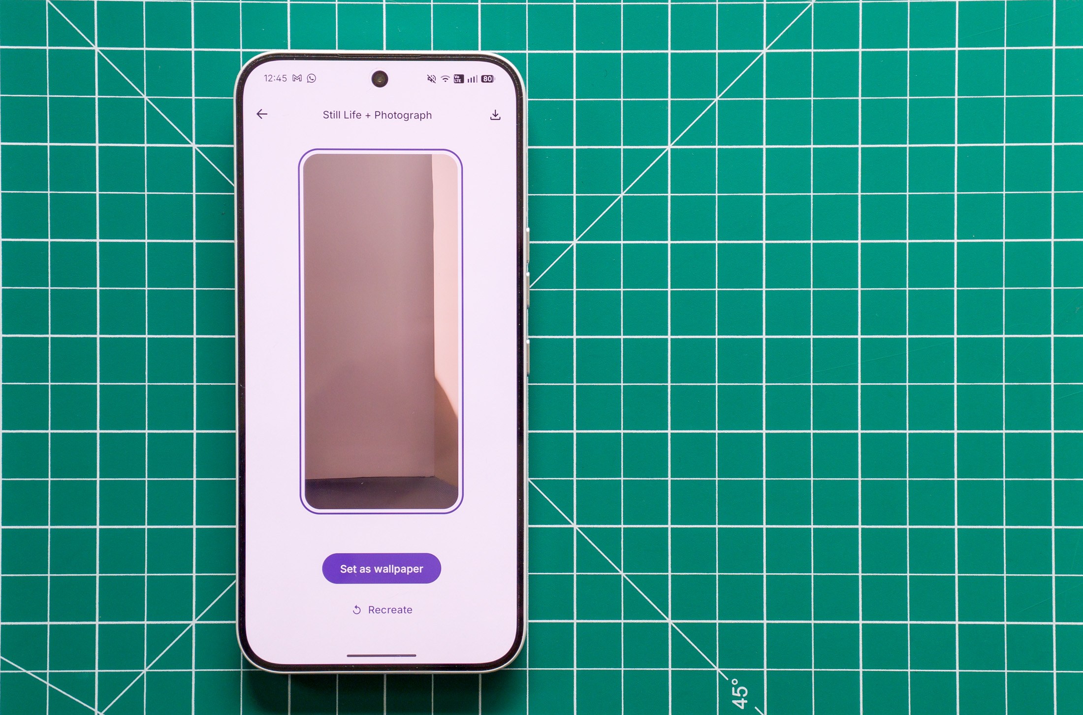 Photo of Nothing Phone 4A Pro on a green cutting mat showing the AI wallpaper generator