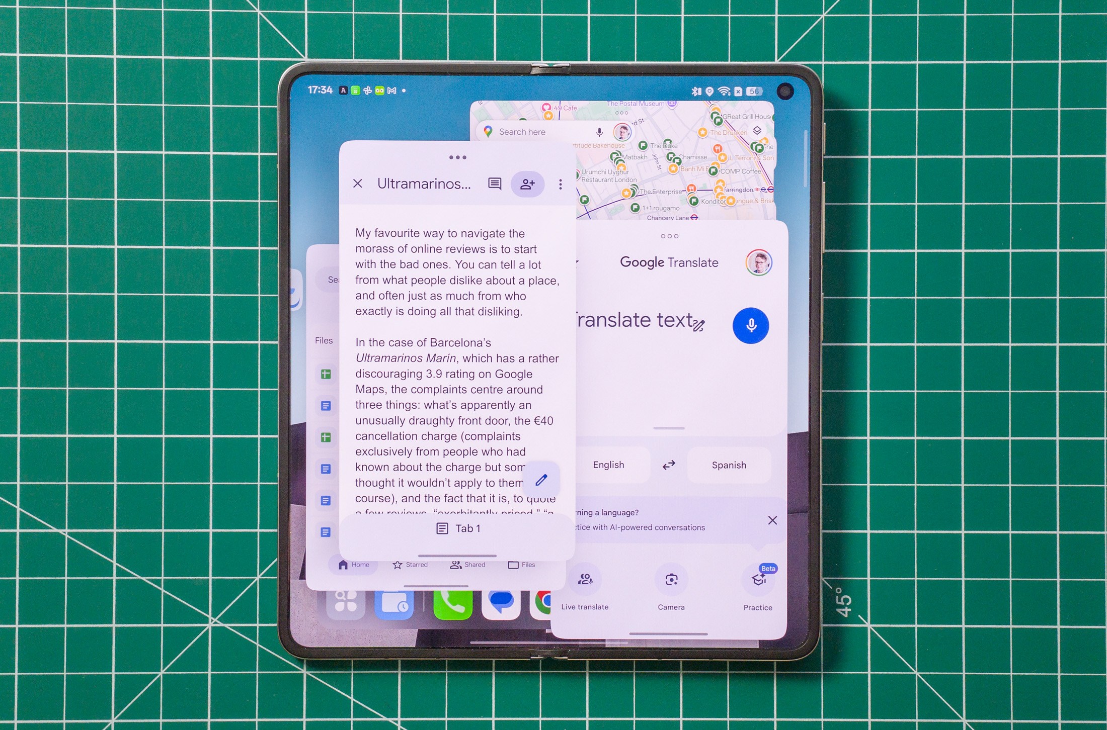 Photo of Oppo Find N6 on a green work mat from above, showing new floating window multitasking