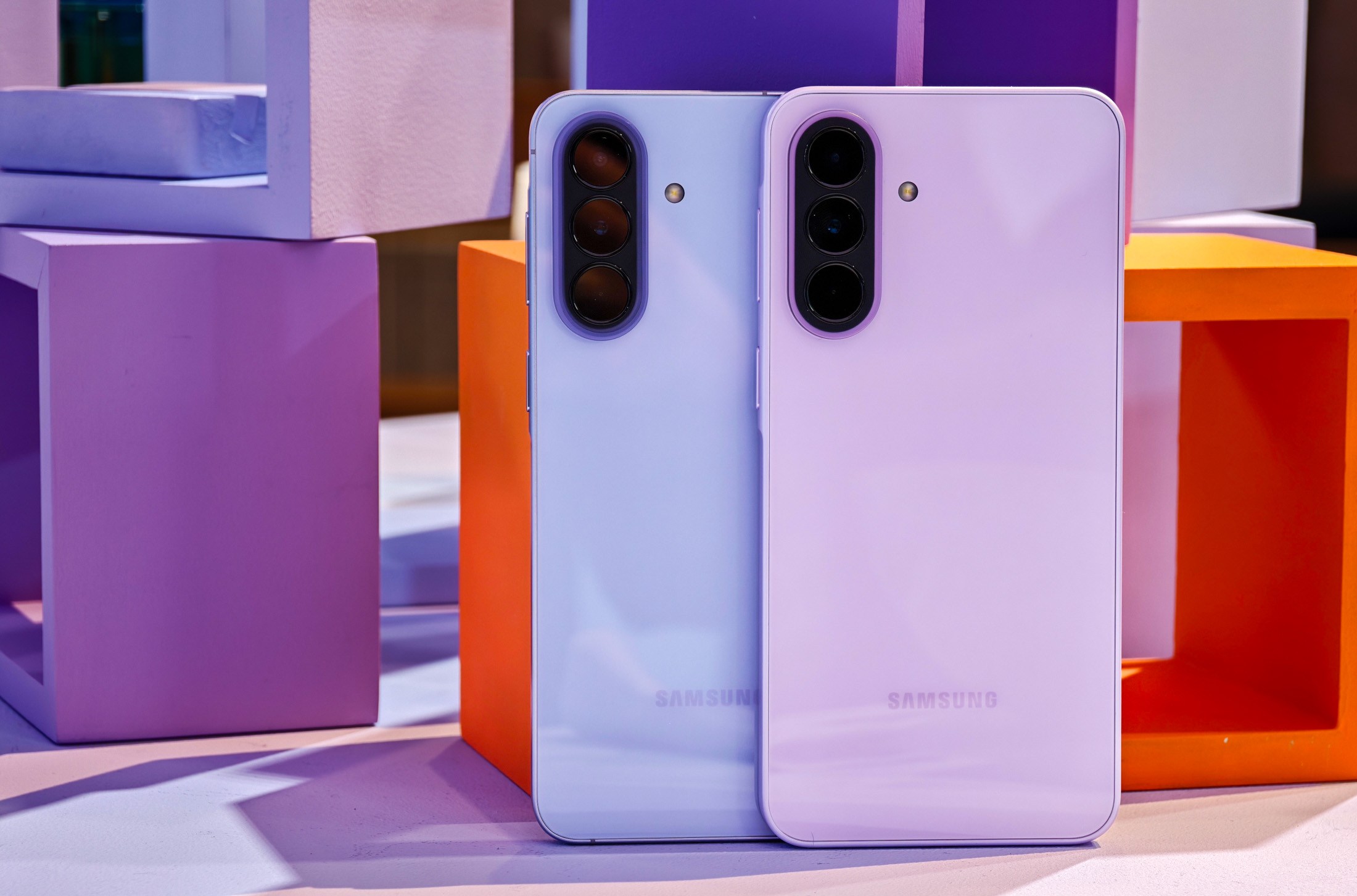 Samsung Galaxy A57 and A37 in front of colored cubes