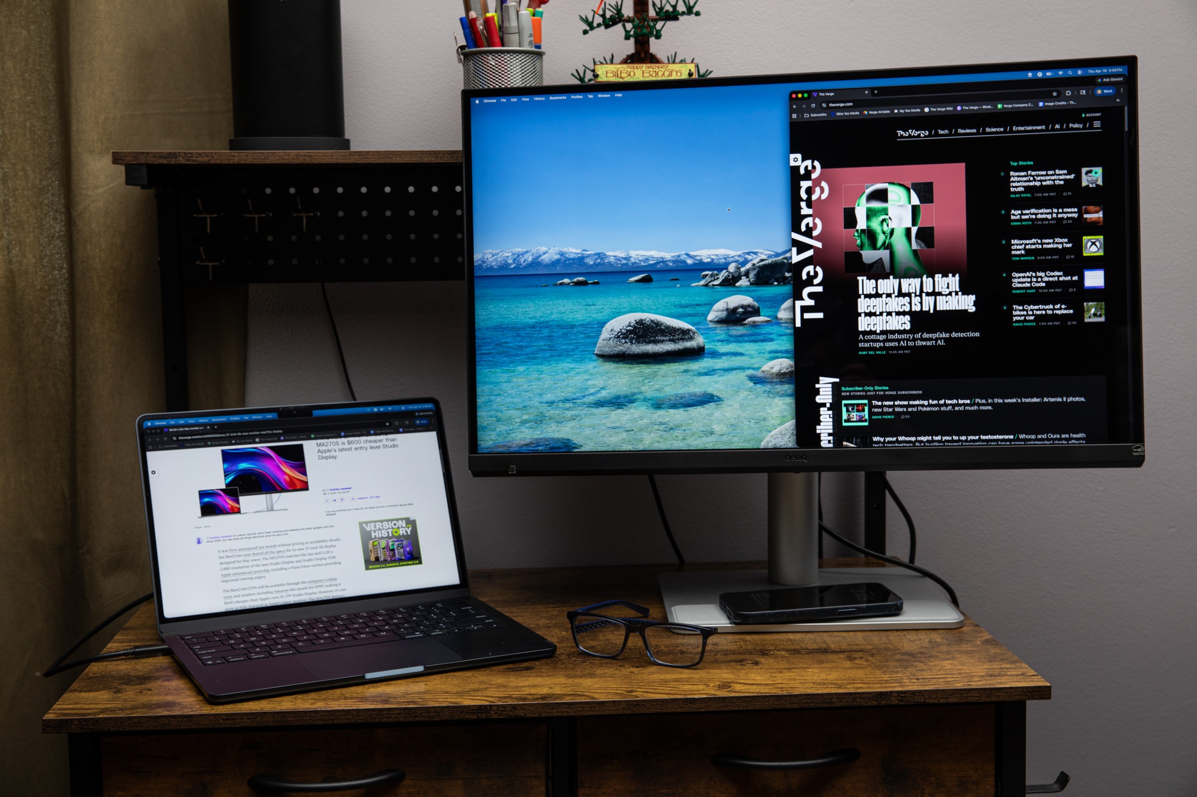 The BenQ MA270S on a wooden desk next to a MacBook Air.