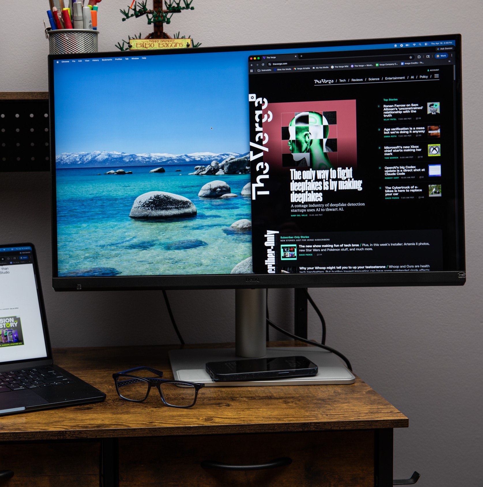 The BenQ MA270S on a wooden desk next to a MacBook Air.