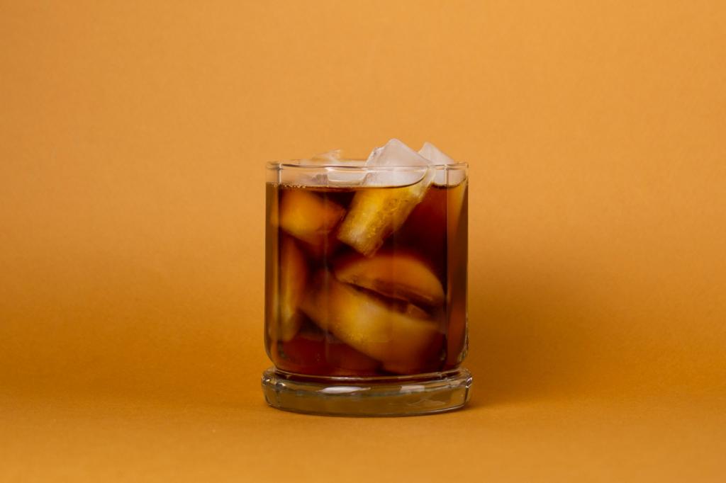Cold brew coffee on orange background