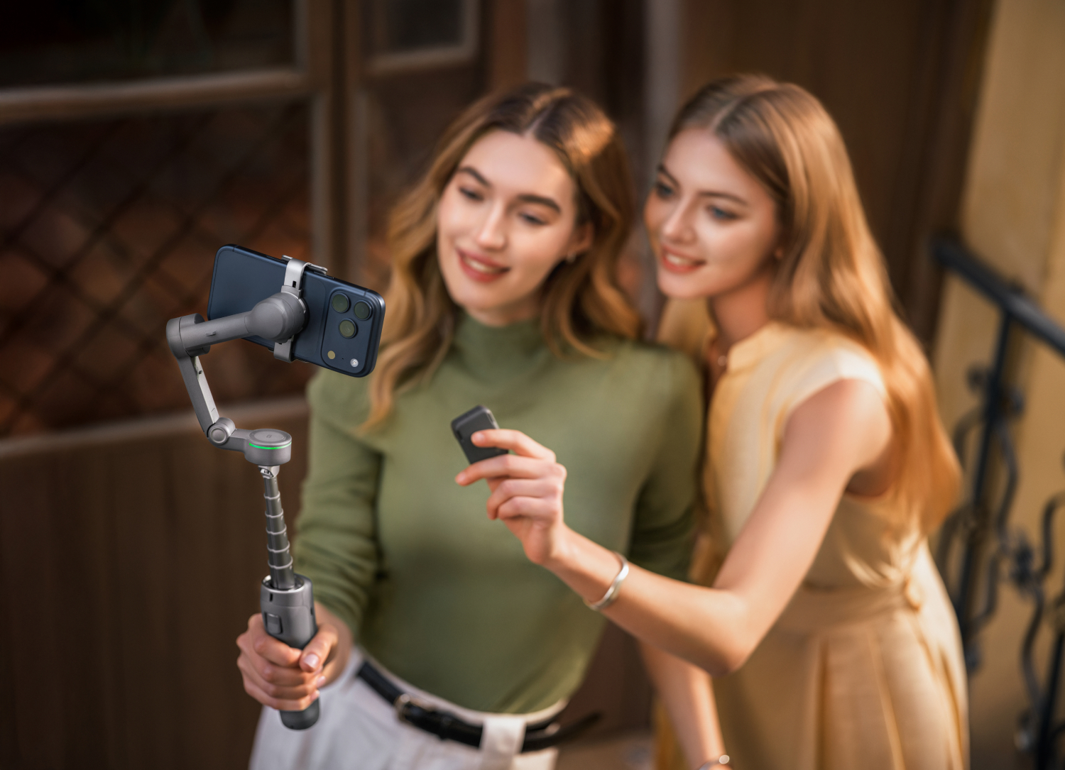 Two women using a DJI Osmo Mobile 8P to take a selfie