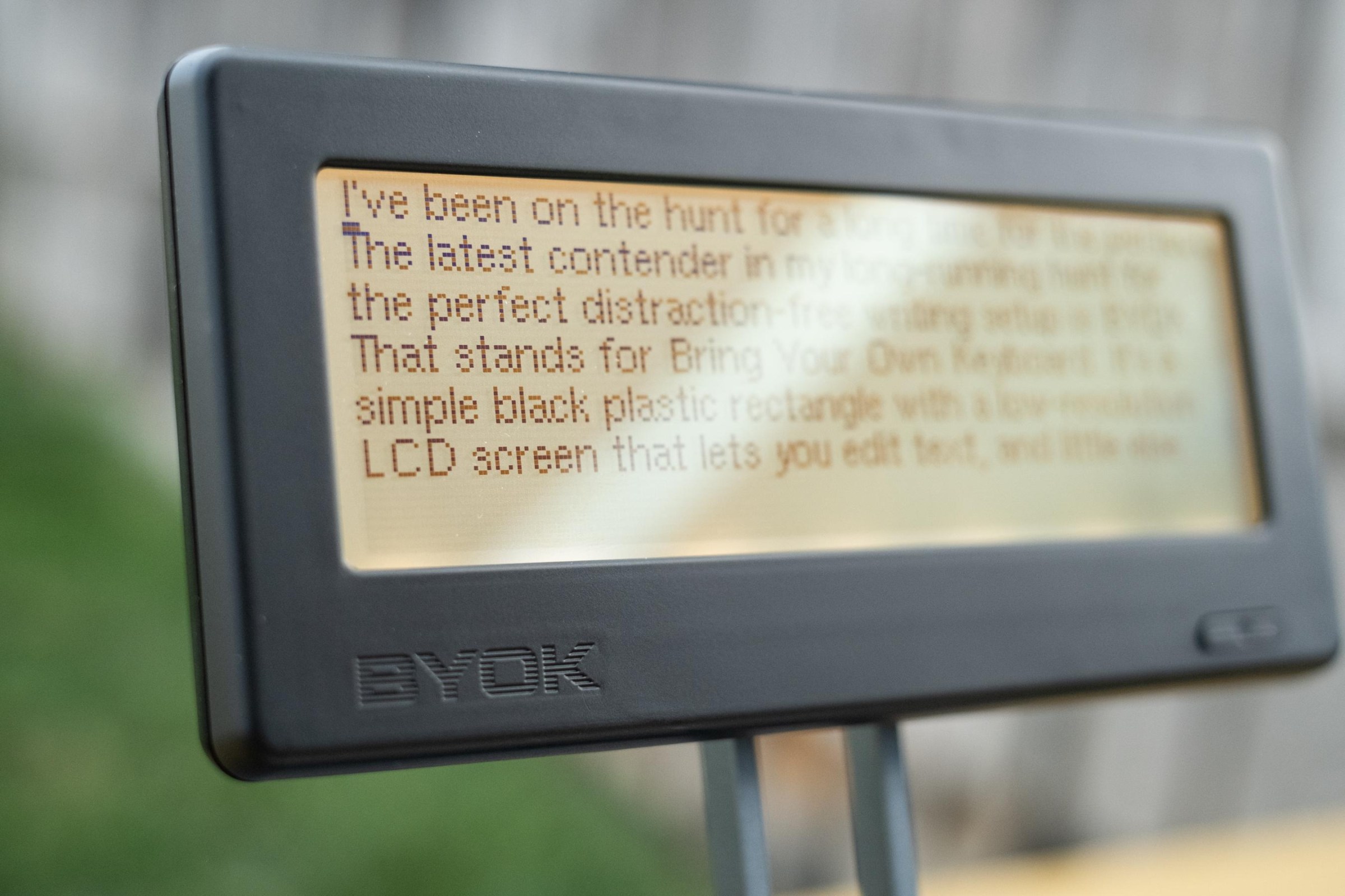 The BYOK at an angle under strong sunlight outdoors.
