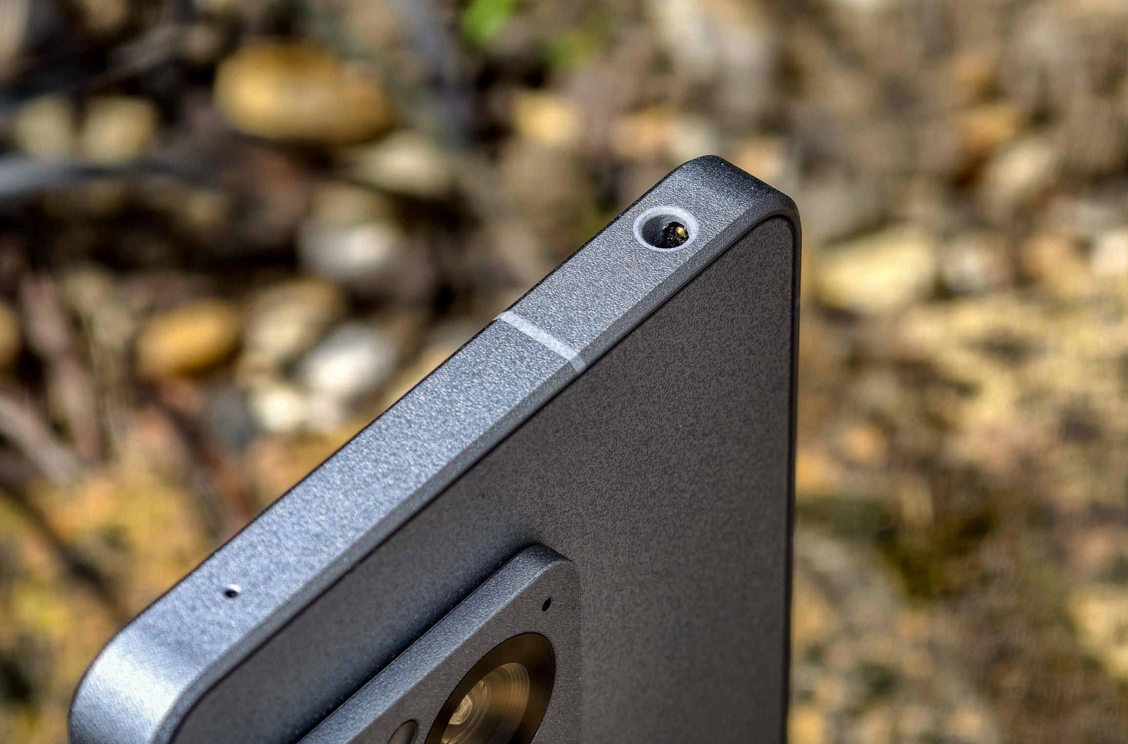 Photo of the Sony Xperia 1 VIII in front of dirt, showing the headphone jack slot