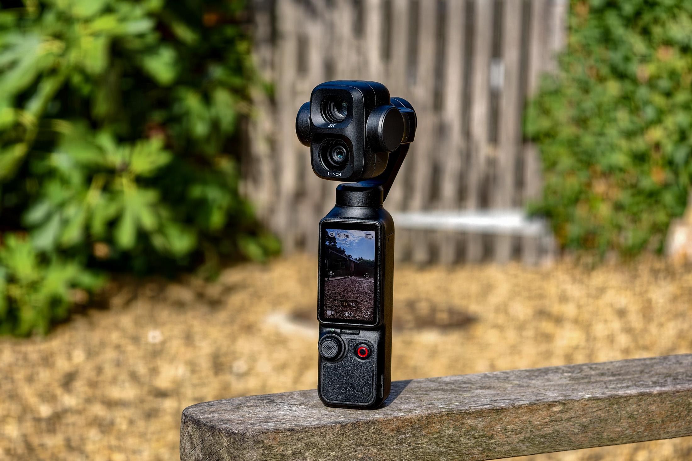 Photo of DJI Osmo Pocket 4P showing the screen oriented vertically and the cameras facing forwards.