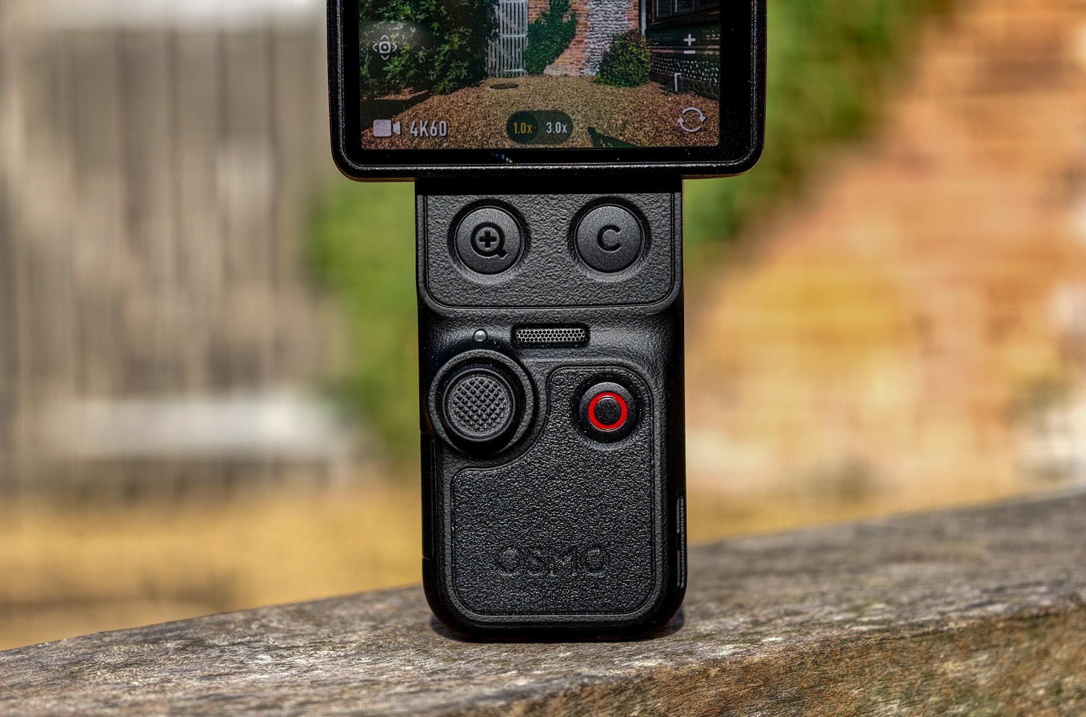 Photo of DJI Osmo Pocket 4P showing the controls, with three buttons and a joystick.