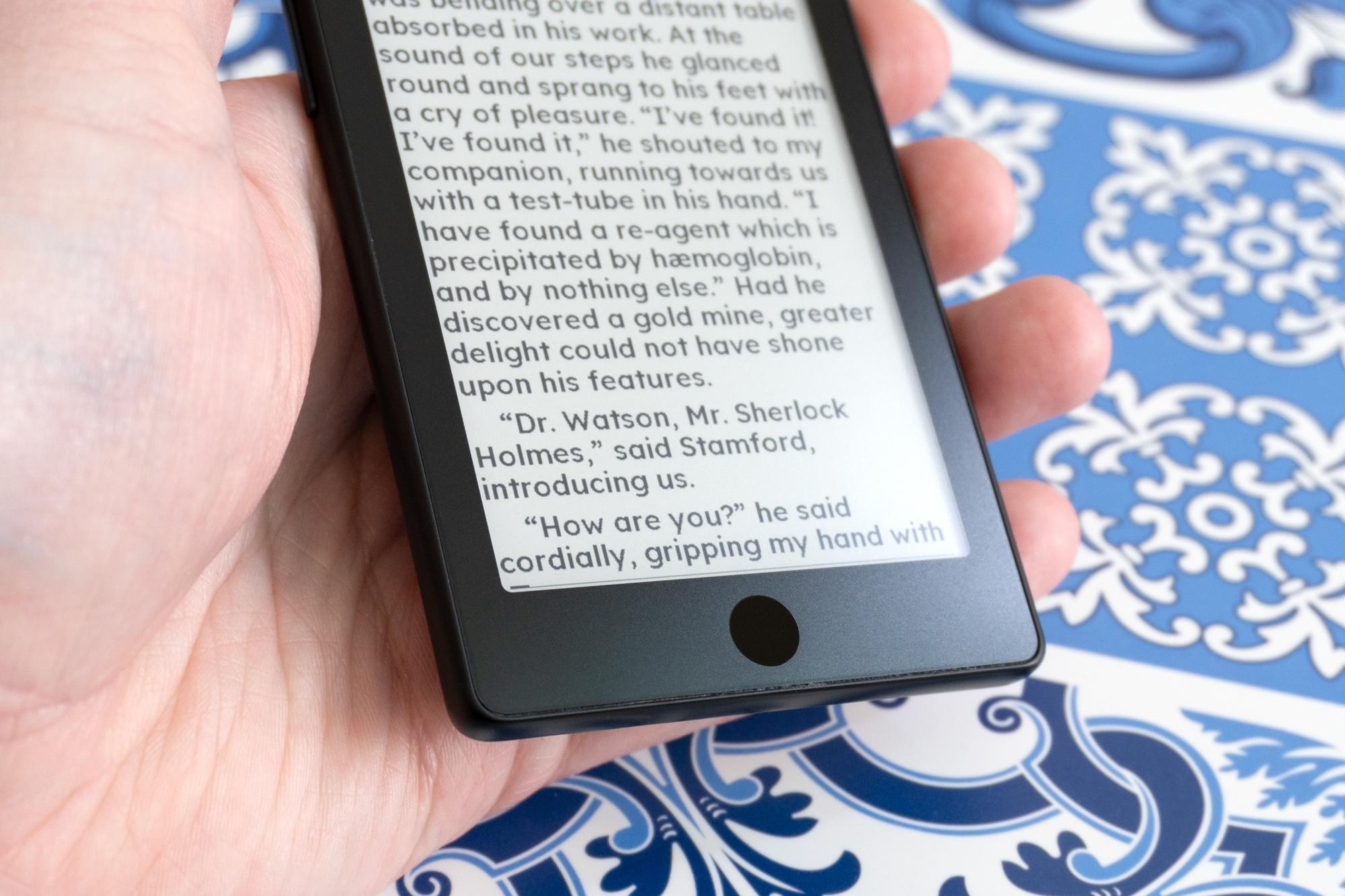 A close-up of the touch home button on the front of the Xteink X4 Pro.
