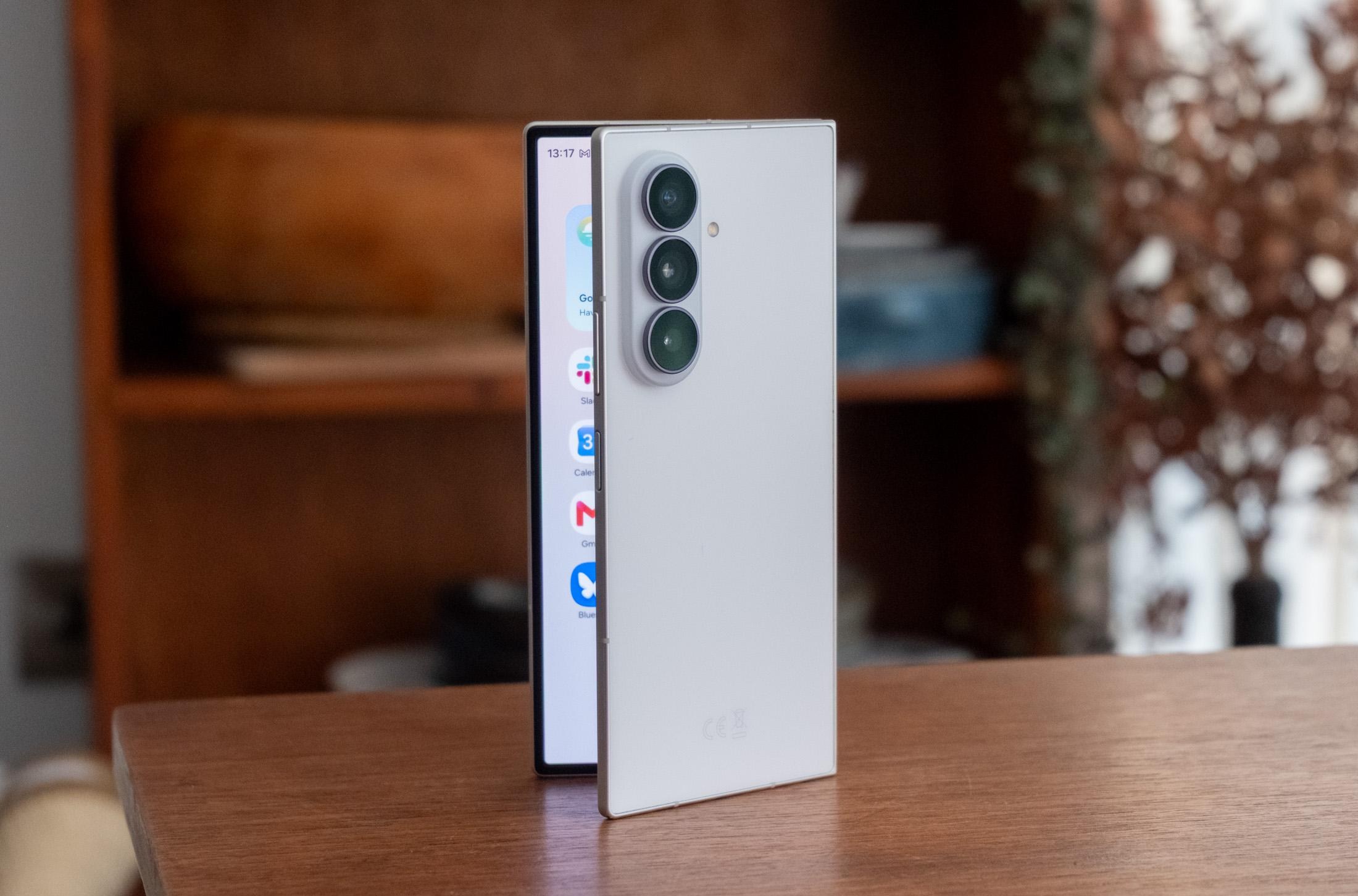 Photo of Samsung Galaxy Z Fold 8 Ultra in front of a bookcase, showing the rear and a little of the inner screen