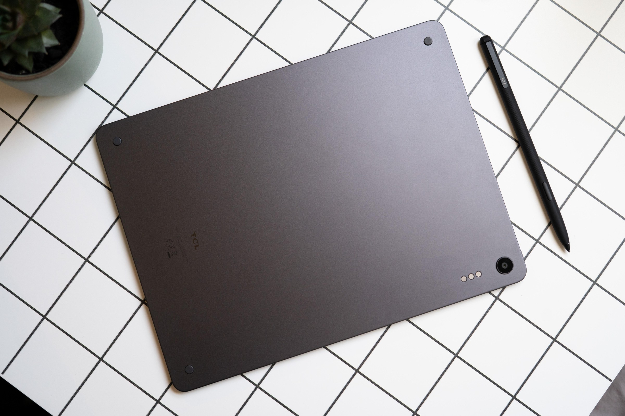 Photo of back of TCL tablet shown next to stylus.