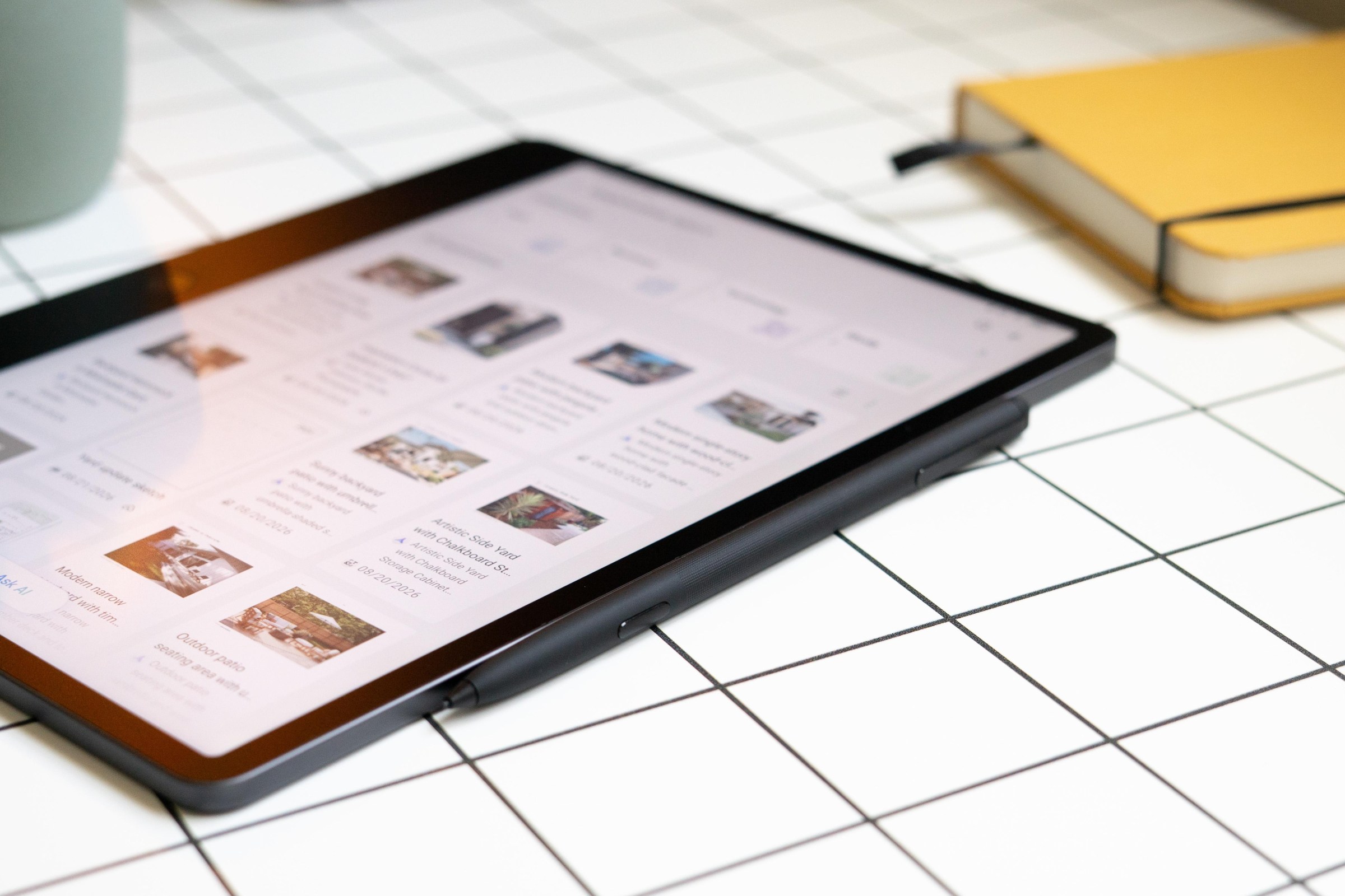 Photo of TCL tablet and stylus shown from the side.
