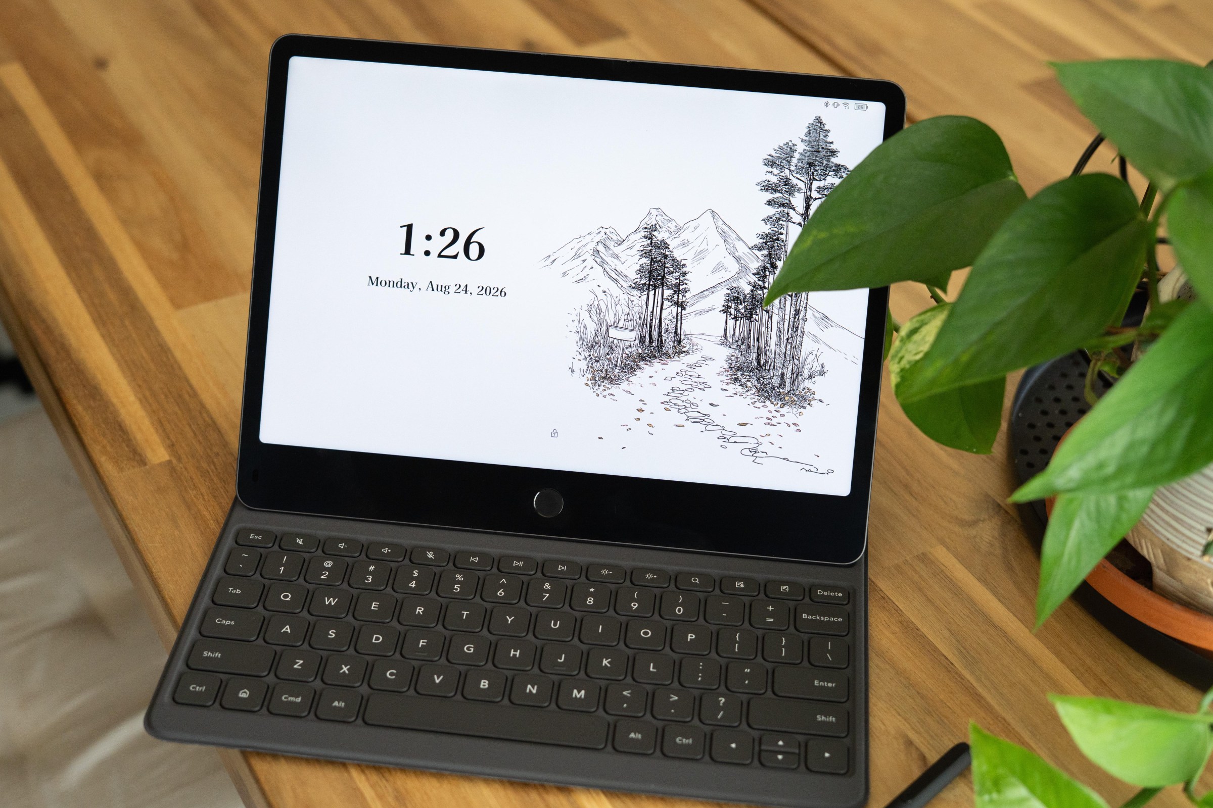 Photo of TCL tablet with keyboard case on a table.