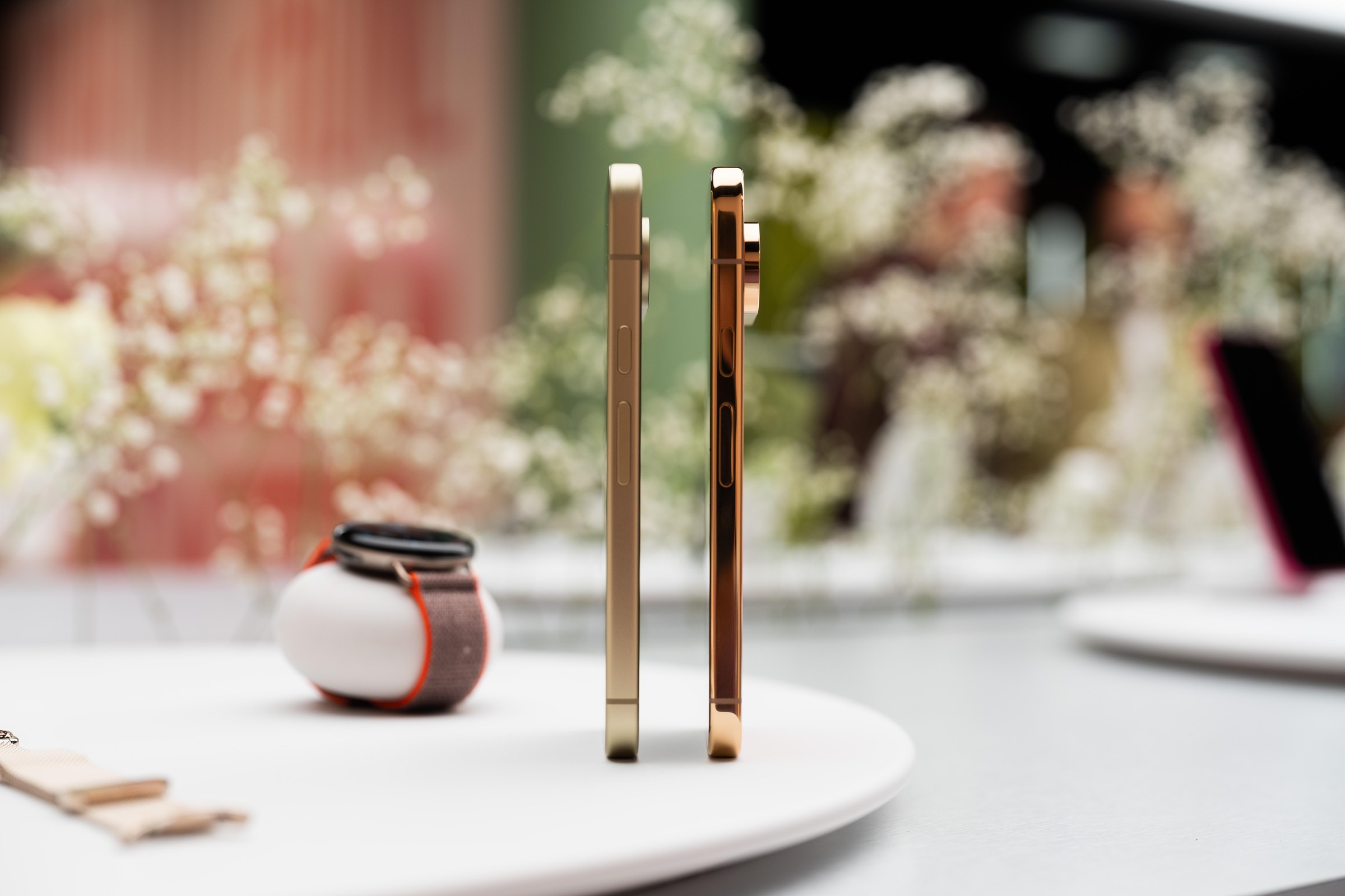 The Pixel 11 and Pixel 11 Pro pictured vertically, side by side. The camera bump on the Pro is significantly larger than on the standard Pixel 11.