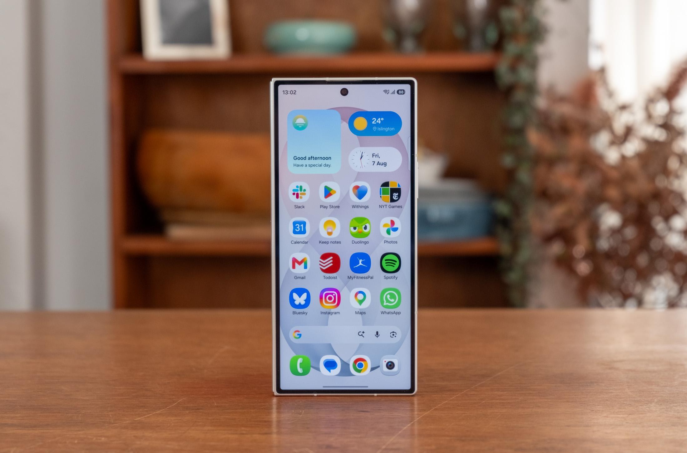Photo of Samsung Galaxy Z Fold 8 Ultra in front of a bookcase, showing the front display