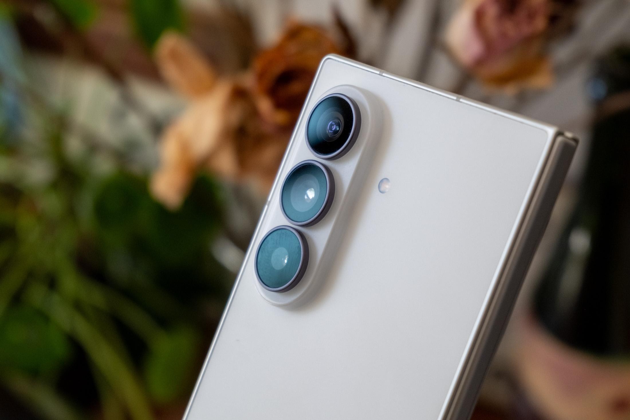 Photo of Samsung Galaxy Z Fold 8 Ultra in front of flowers, showing the cameras