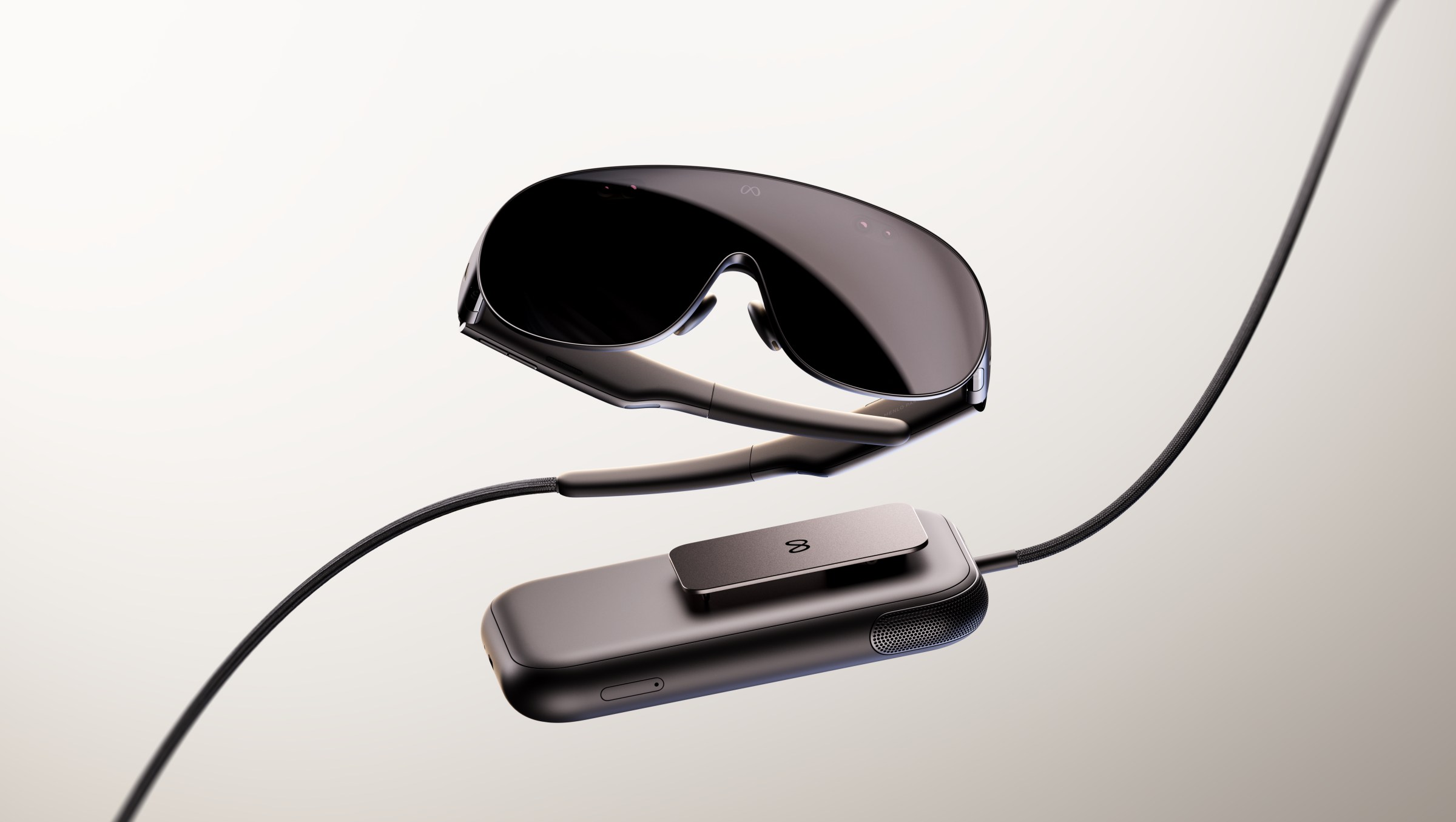 A promotional image of the VR Glasses and its compute puck.